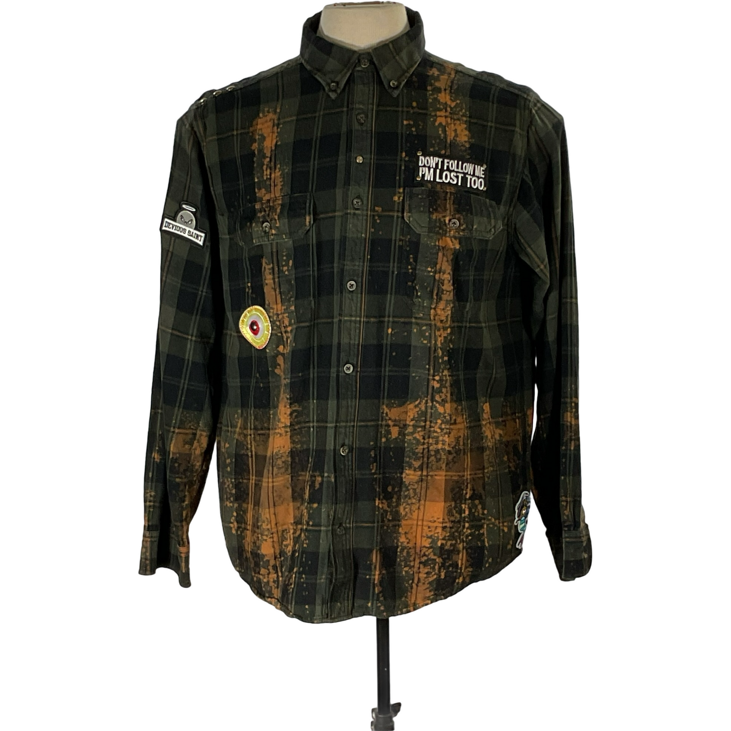 Green and black flannel shirt with bleached treatment, hand-patched details, and metal studs, embodying a unique vintage aesthetic, titled GET FUNKED UP.
