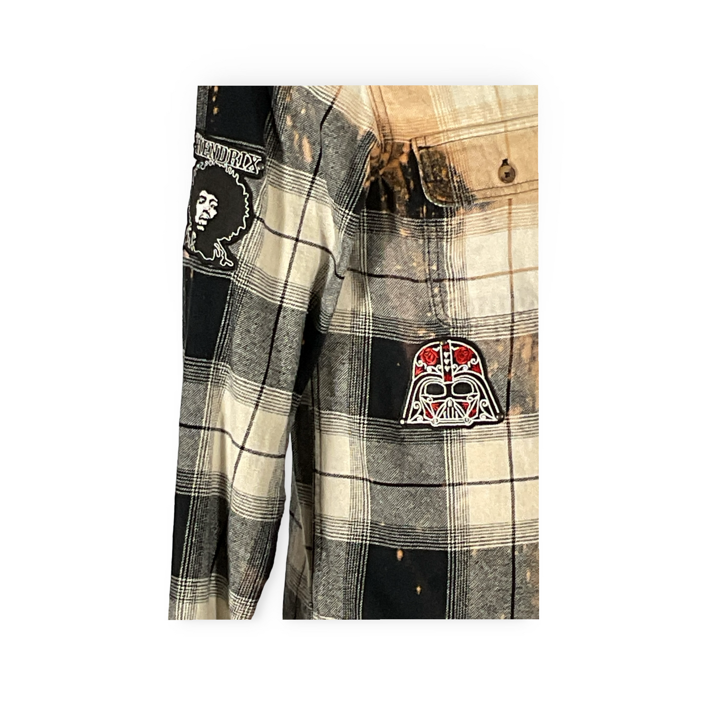 Close-up of the Cyber Bear flannel shirt, showcasing hand-patched details and metal studding, embodying sustainable fashion with a unique, vintage aesthetic.