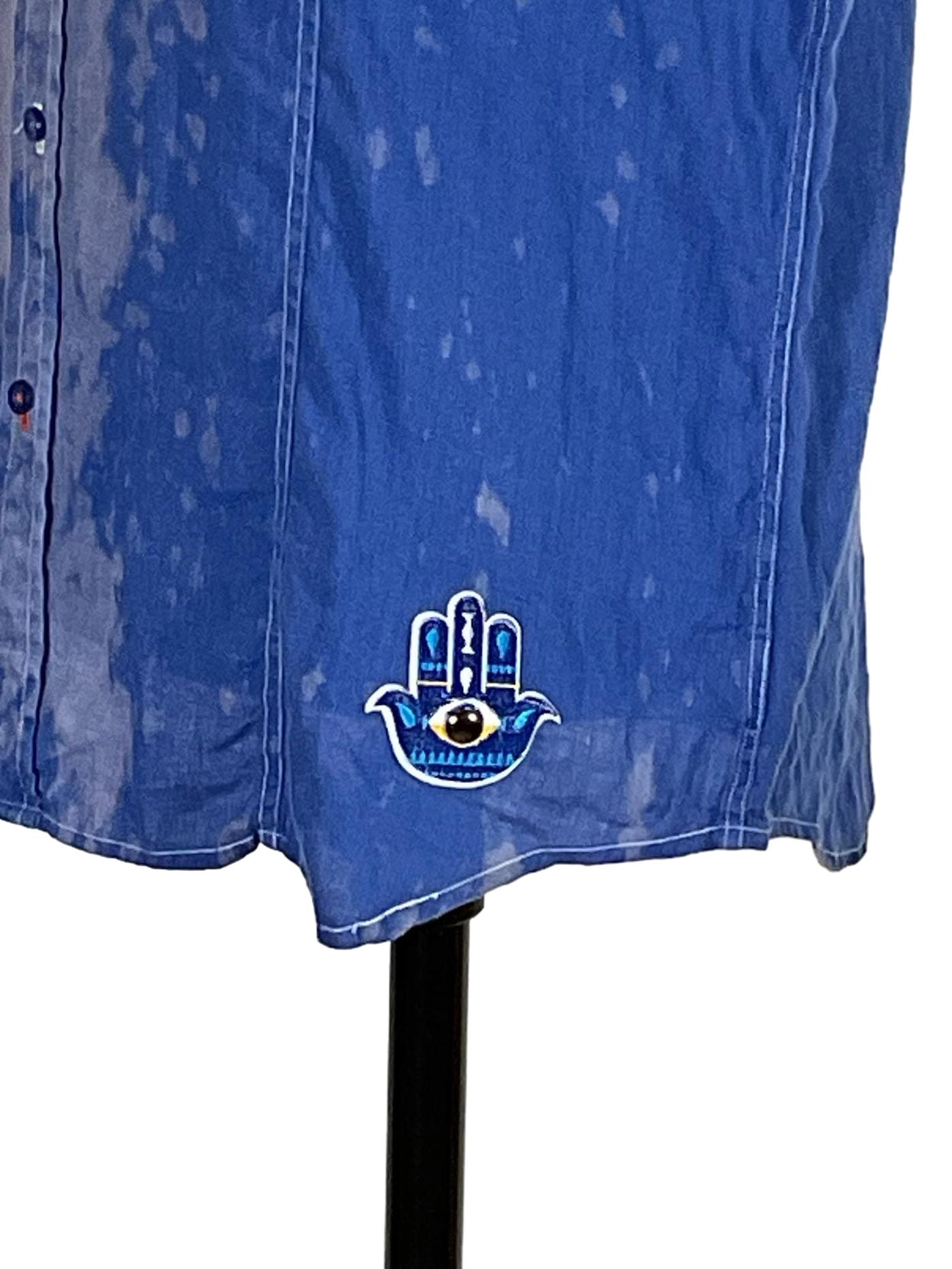 WEIRD CHARACTER Men's Custom Sleeveless Shirt featuring a bold hamsa design on blue linen, combining unique, artistic style with a medium fit.