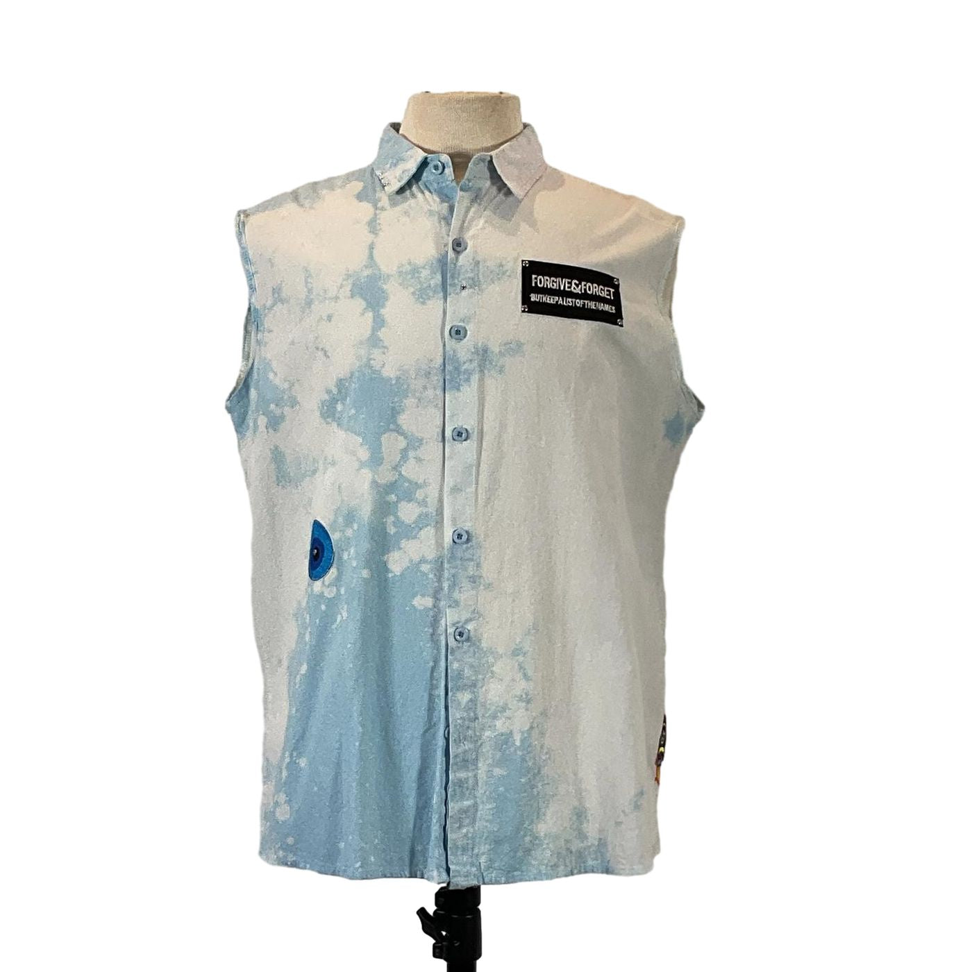 PADRINO SHARK Men's Custom Sleeveless Shirt displayed on mannequin, showcasing unique design and craftsmanship, embodying bold, distinctive style from DEVIOUS SAINT.
