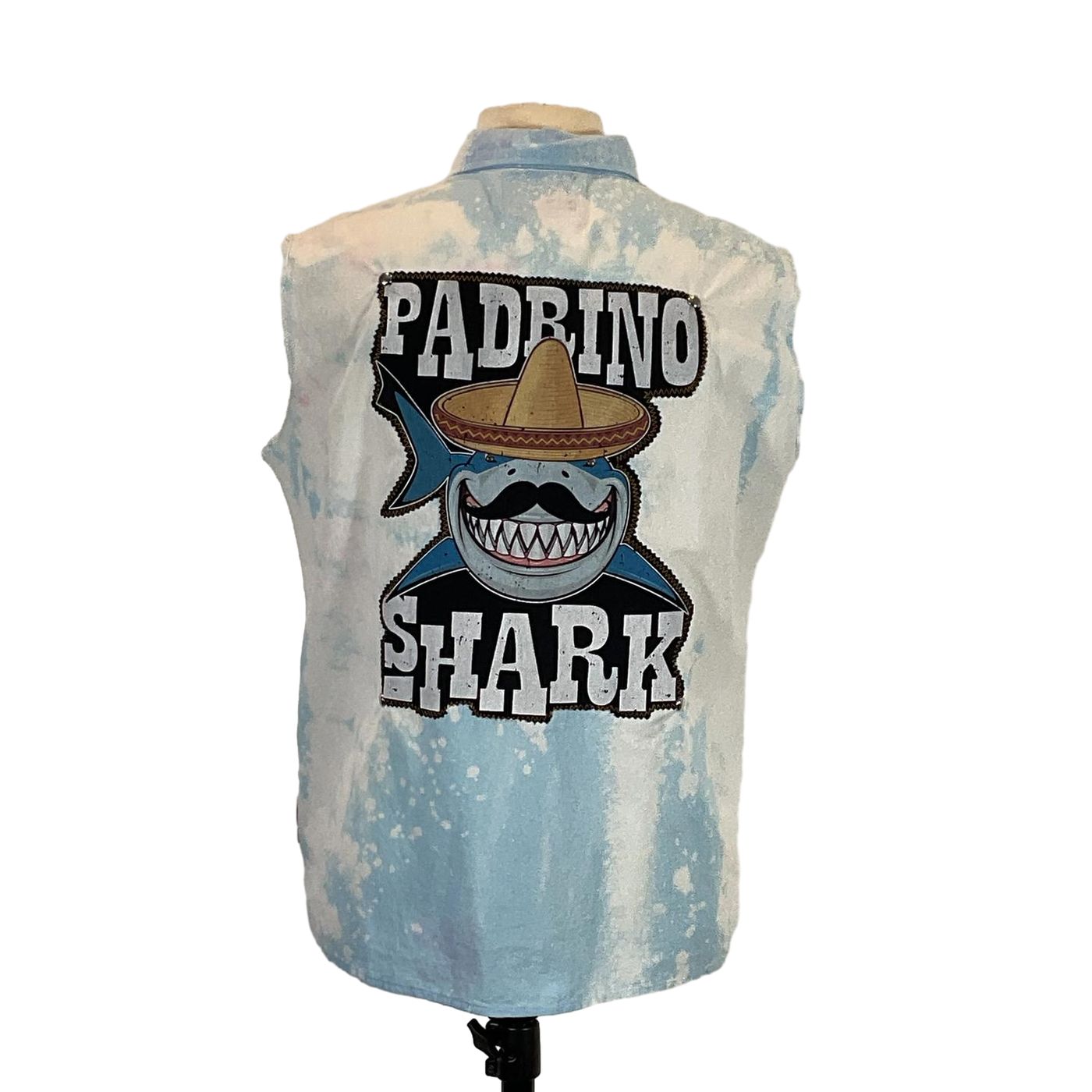 PADRINO SHARK Men's Custom Sleeveless Shirt featuring a cartoon shark with a mustache and sombrero, crafted from pre-owned cotton, embodying unique wearable art.