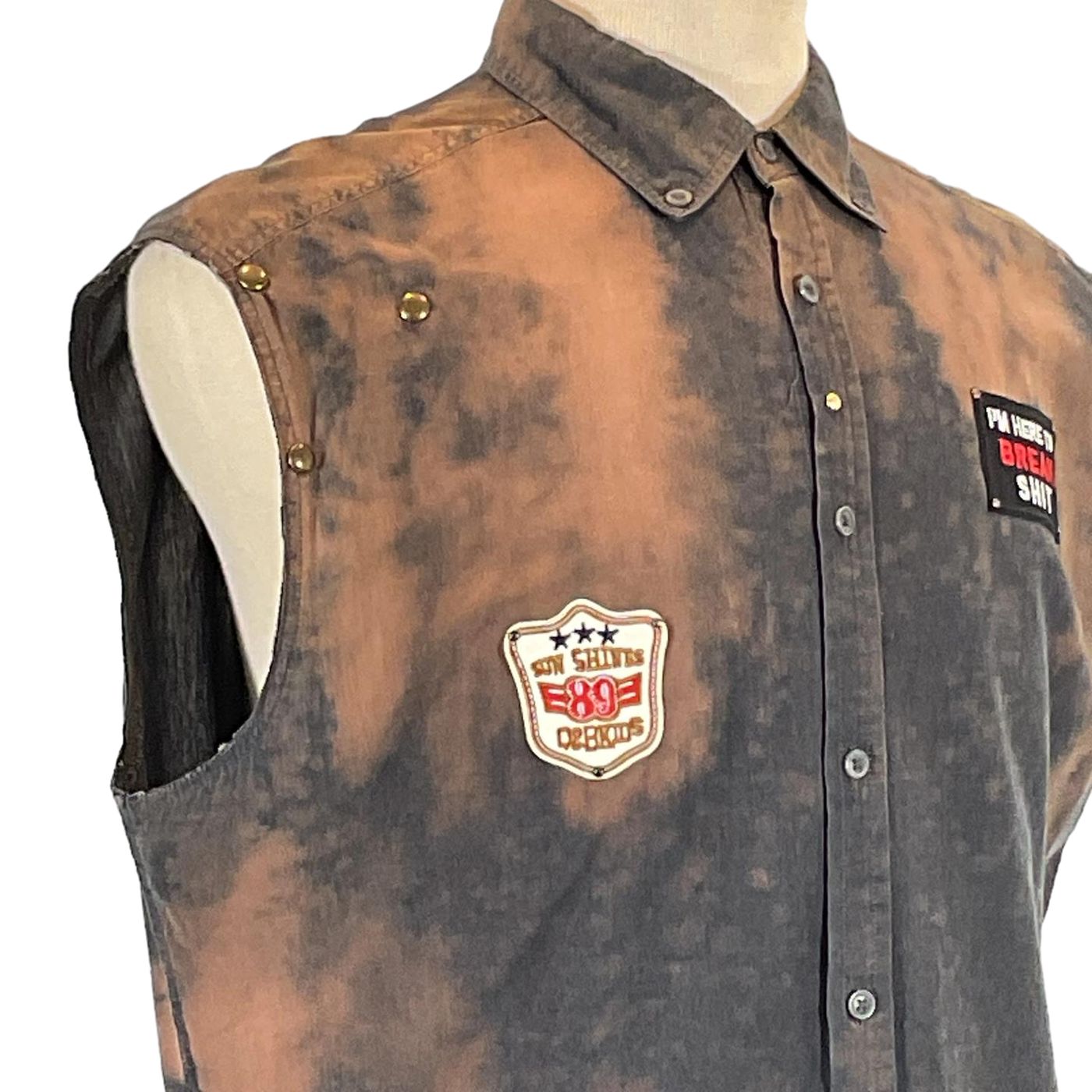 SMILE BRO Men's Custom Sleeveless Shirt, featuring a close-up of detailed button and patch design, reflecting DEVIOUS SAINT's bold, unique wearable art style.