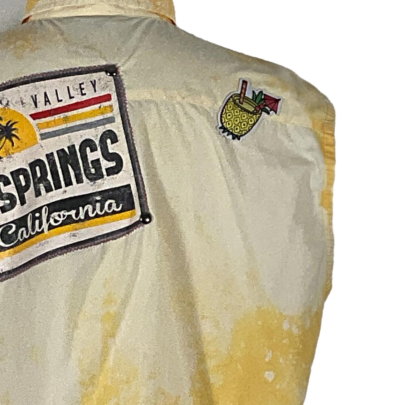 Close-up of the PALM SPRINGS Men's Custom Sleeveless Shirt, featuring a unique design crafted from pre-owned cotton, embodying the bold style of DEVIOUS SAINT.