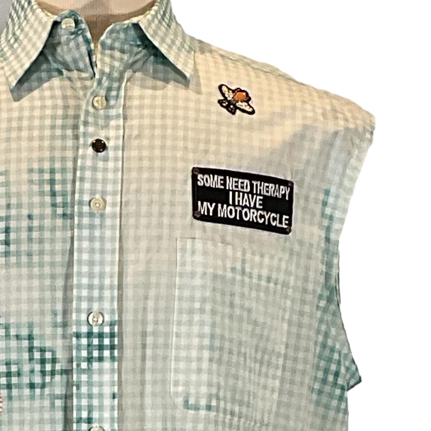 PAW Men's Custom Sleeveless Shirt with patches, featuring a plaid design and visible buttons, highlighting DEVIOUS SAINT's unique, bold style in wearable art.