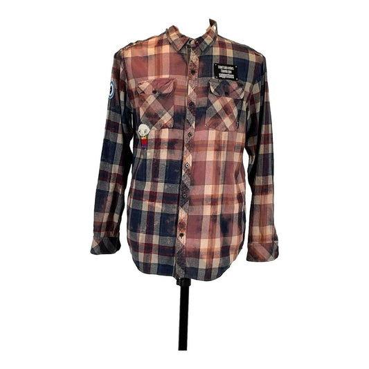 THE ICEMAN Men's Custom Long-Sleeve Flannel Shirt displayed on a mannequin, featuring a unique plaid pattern and a distinctive patch detail.