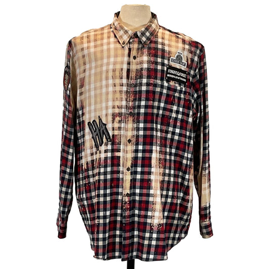 NIRVANA Men's Custom Long-Sleeve Flannel Shirt on mannequin, featuring a red plaid pattern with unique patch detail, showcasing bold, artistic design.