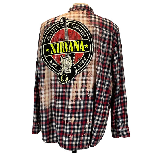 NIRVANA Men's Custom Long-Sleeve Flannel Shirt with plaid pattern and logo, emphasizing unique, bold design from DEVIOUS SAINT, size XX-Large.