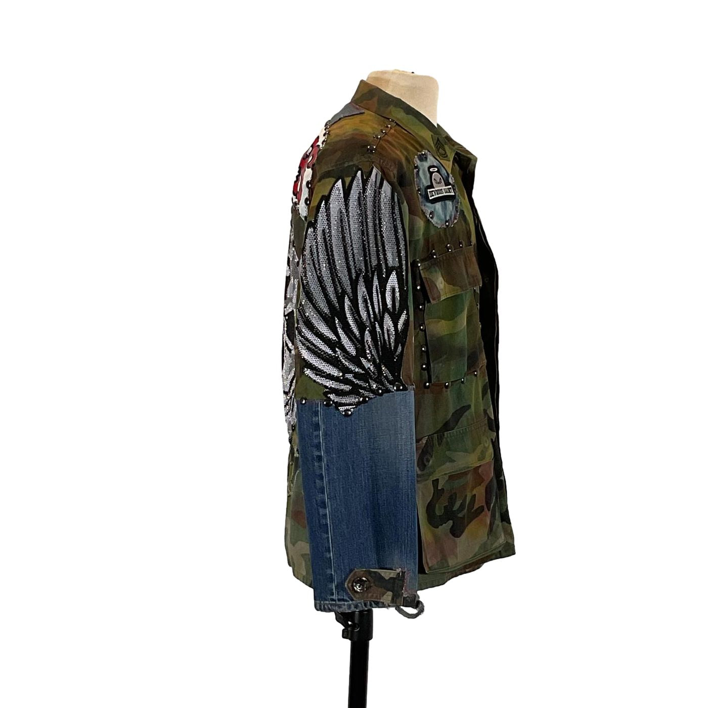 BUITRES Men's Custom Jacket by Devious Saint, featuring camouflage pattern and rhinestone patches, large size with distinctive detailing for a bold, unique look.