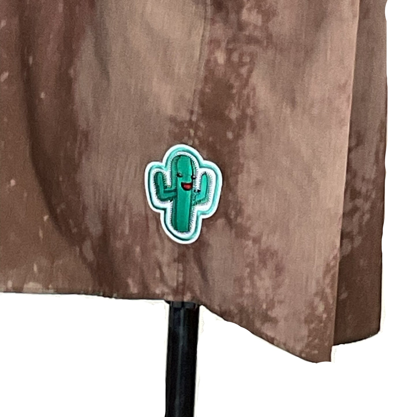 Cartoon-style cactus patch on brown fabric of BERLIN BEAR sleeveless shirt, 2 XL, showcasing bold, urban bear community style from DEVIOUS SAINT.