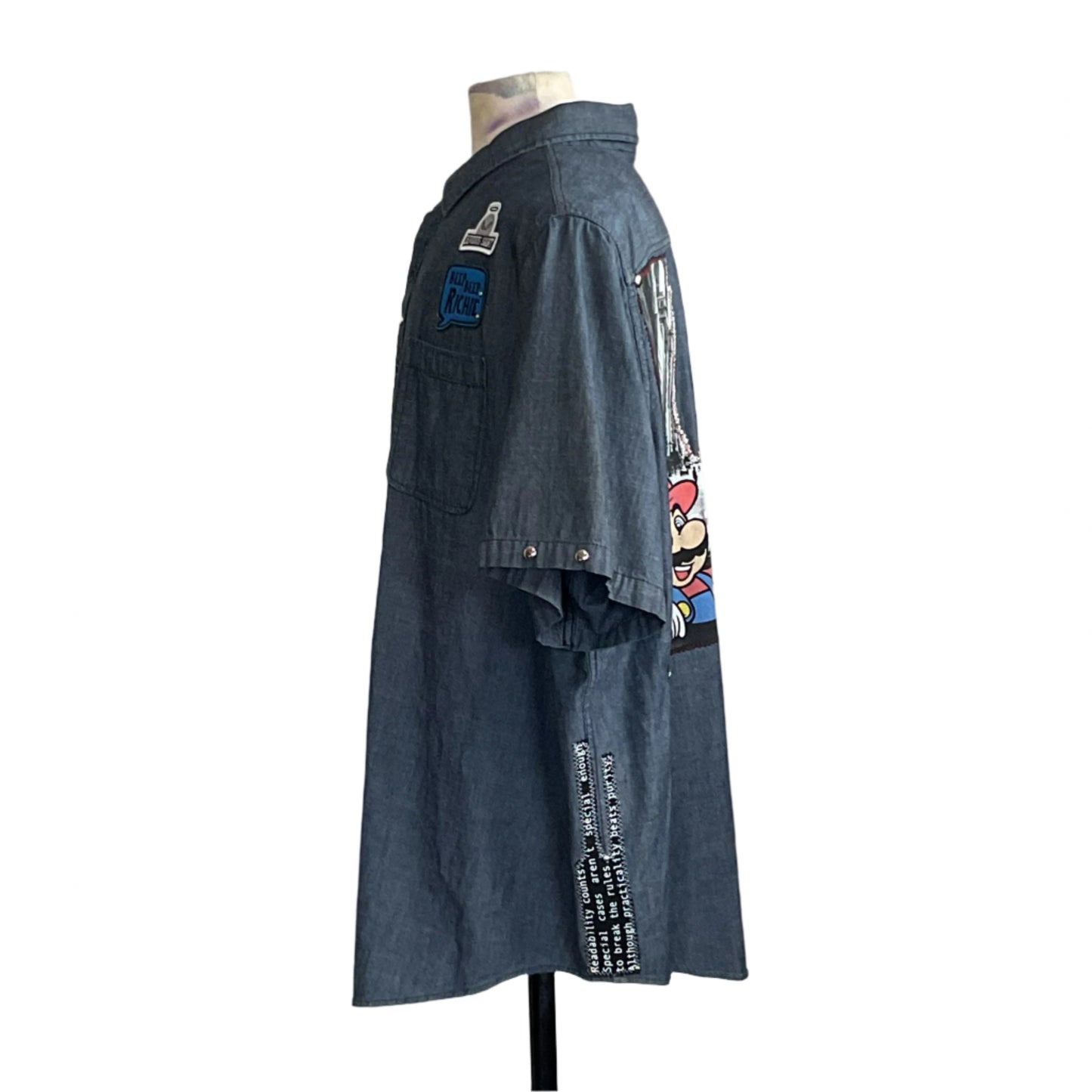 Headless mannequin in MARIO Men's Custom BEAR SIZE Short Sleeve Shirt with Mario graphic, patches, and text details, embodying unique style in 4 XL.