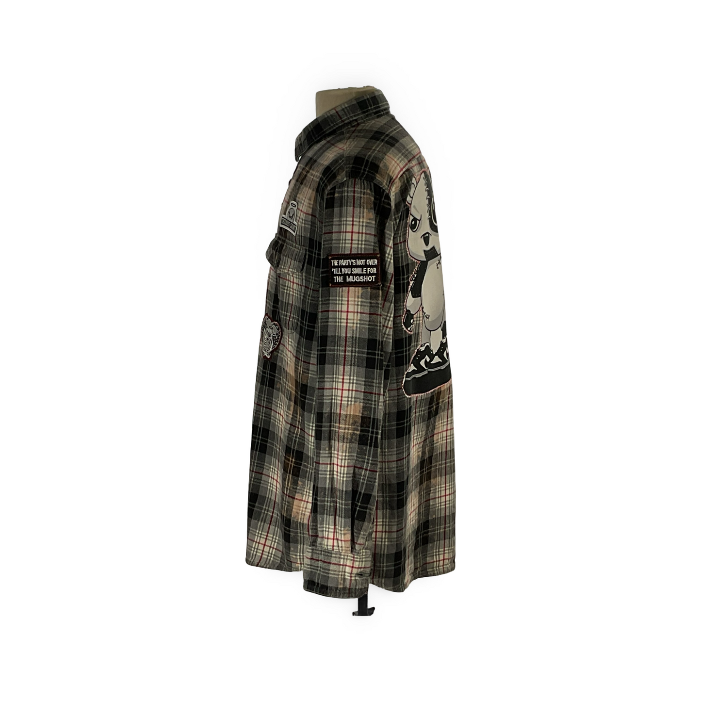 Cyber Bear long sleeve flannel on mannequin, featuring hand-patched details and metal studding, showcasing a unique vintage aesthetic with sustainable, reclaimed cotton craftsmanship.