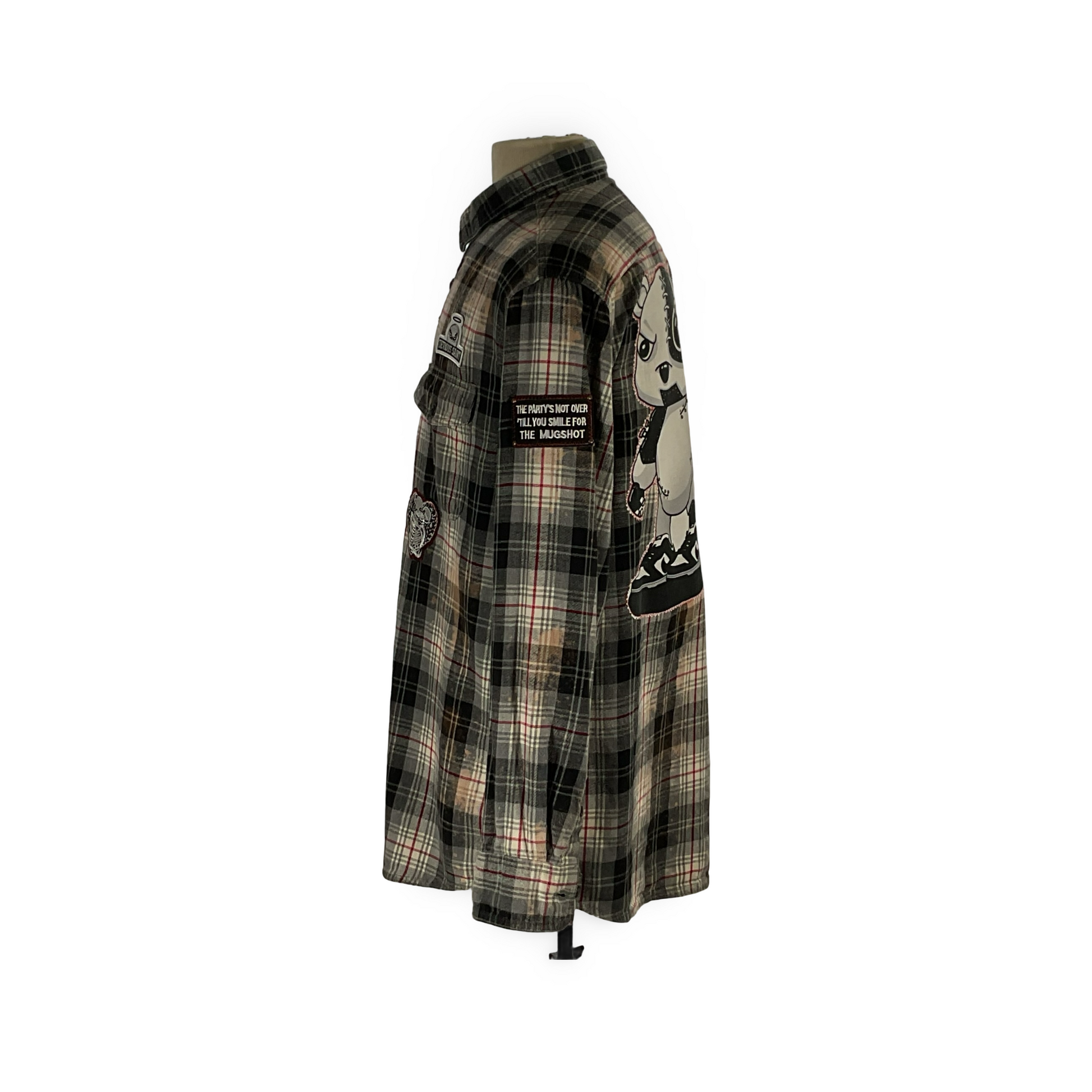 Cyber Bear long sleeve flannel on mannequin, featuring hand-patched details and metal studding, showcasing a unique vintage aesthetic with sustainable, reclaimed cotton craftsmanship.