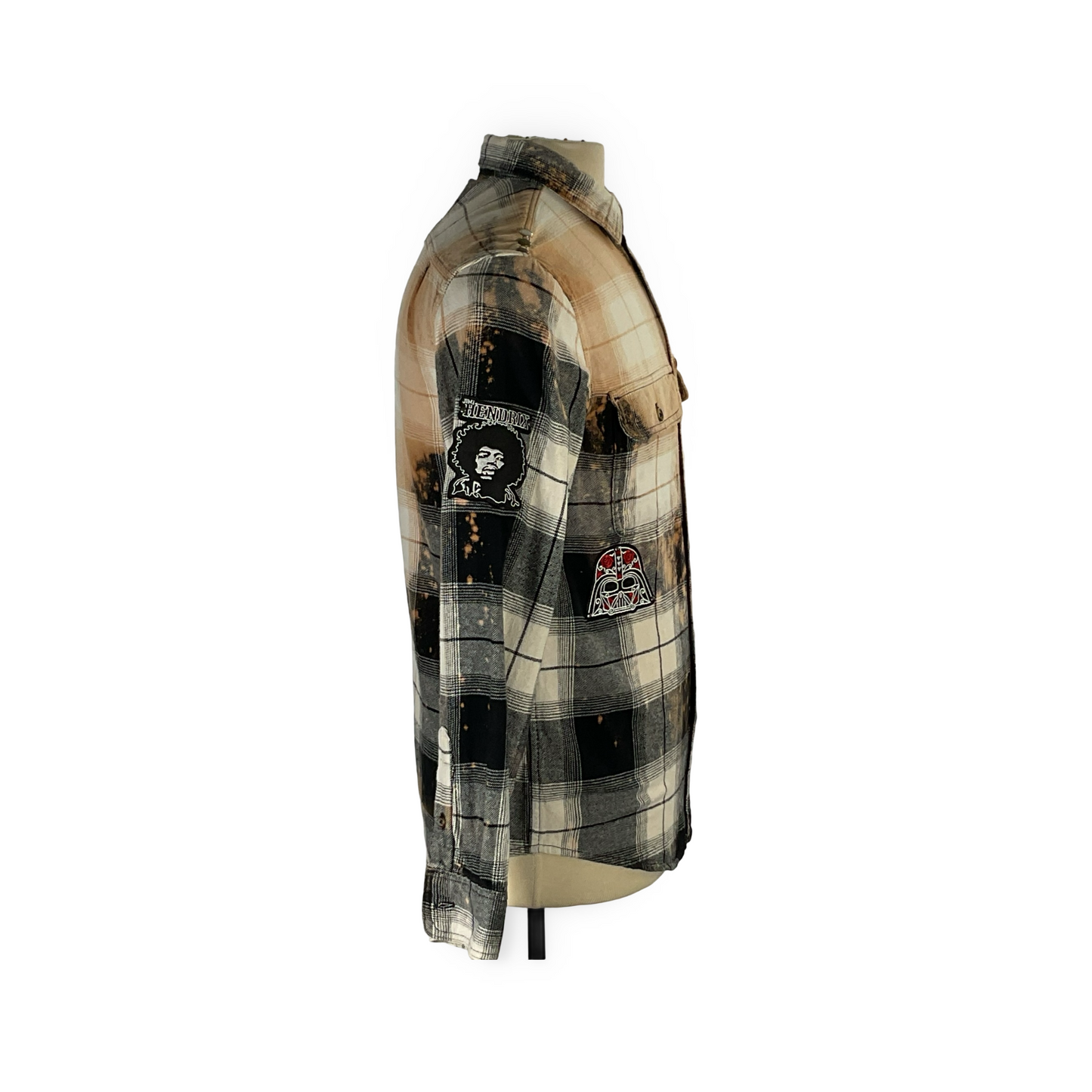 Cyber Bear flannel shirt featuring hand-patched details and metal studding on a mannequin, showcasing a unique, vintage-inspired design crafted from reclaimed cotton.