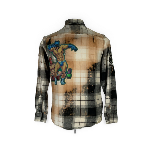 Cyber Bear long sleeve flannel showcases hand-patched details, metal studding, and a vintage aesthetic, emphasizing sustainable fashion with reclaimed cotton and a unique design.