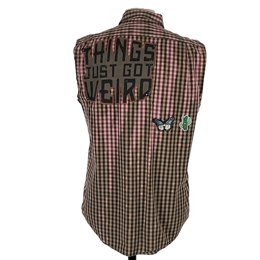 THINGS JUST GOT WEIRD Men's Custom Sleeveless Shirt on a mannequin, showcasing unique patches including a butterfly and cactus design on plaid fabric.