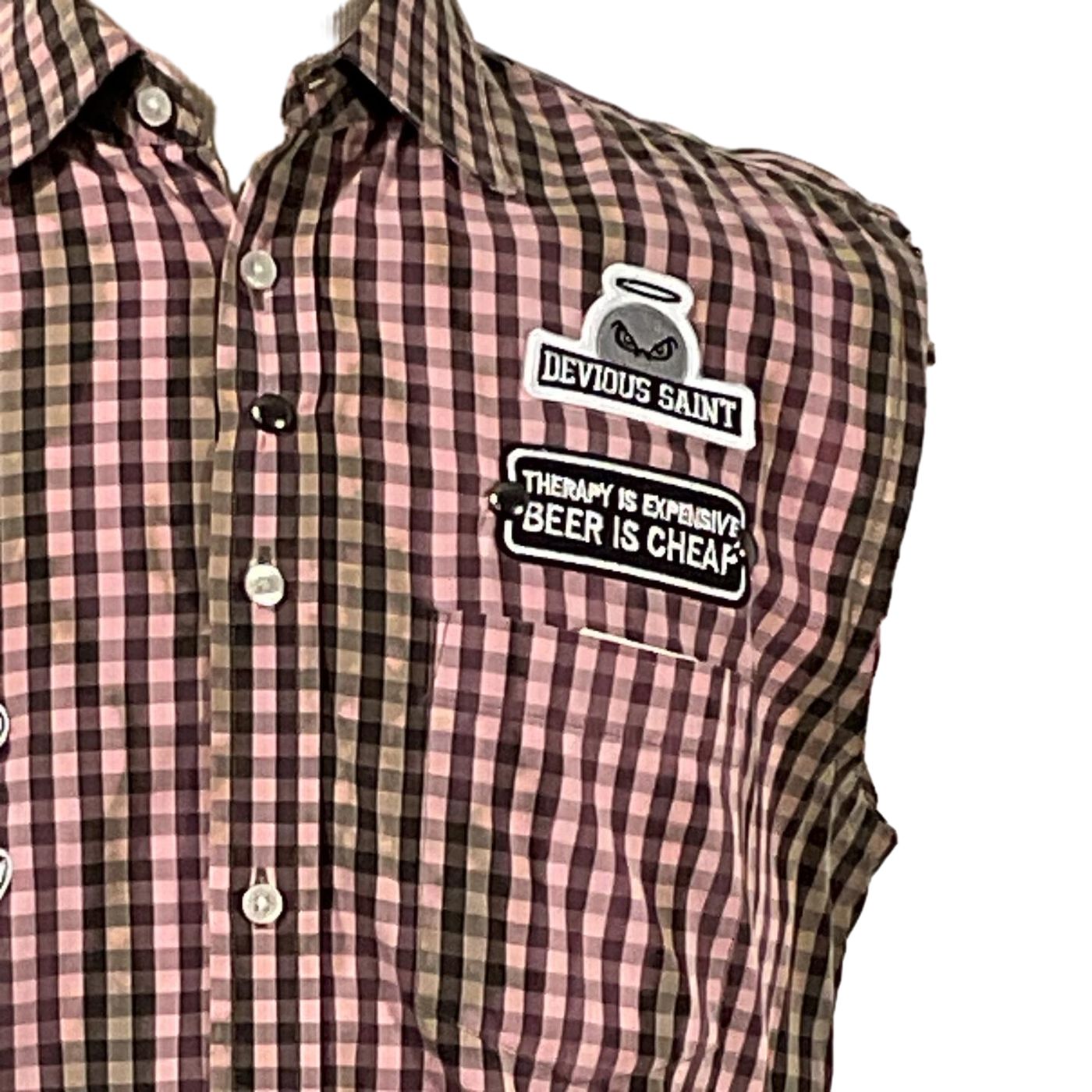 Close-up of THINGS JUST GOT WEIRD Men's Sleeveless Shirt with plaid pattern. Features buttons and collar, embodying DEVIOUS SAINT's bold, distinctive style.