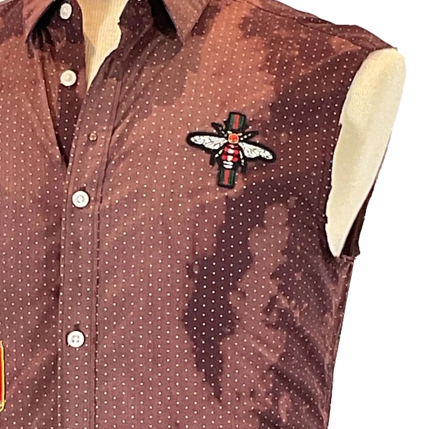 GET IN THERE Men's Custom Sleeveless Shirt featuring a brown dot pattern and button detail, highlighting its unique style from DEVIOUS SAINT.