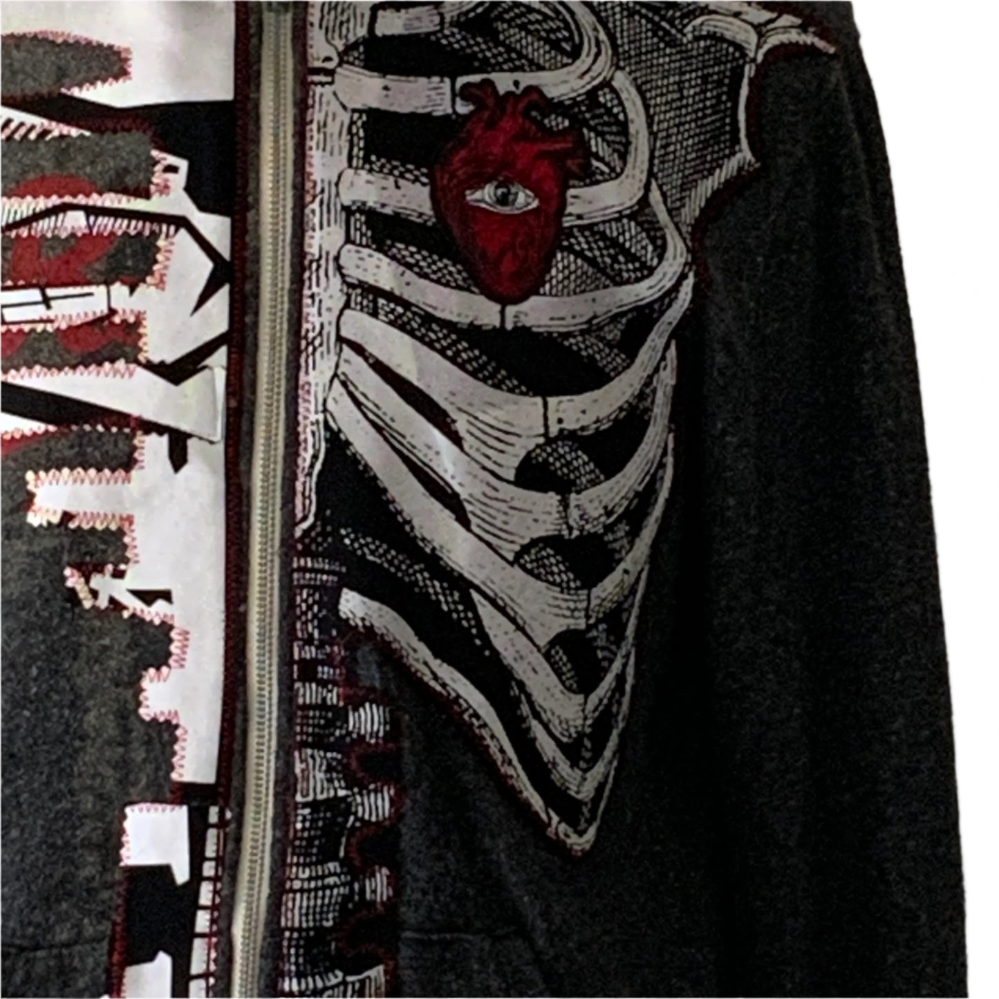 BAUHAUS Custom Men's Hoodie in medium size, featuring a stylized skeleton ribcage with a red anatomical heart and eye motif, plus jagged cityscape graphics.