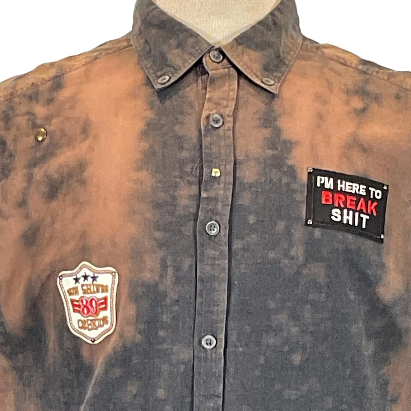 Close-up of SMILE BRO Men's Custom Sleeveless Shirt featuring detailed buttons and collar, highlighting the unique craftsmanship of DEVIOUS SAINT's wearable art.