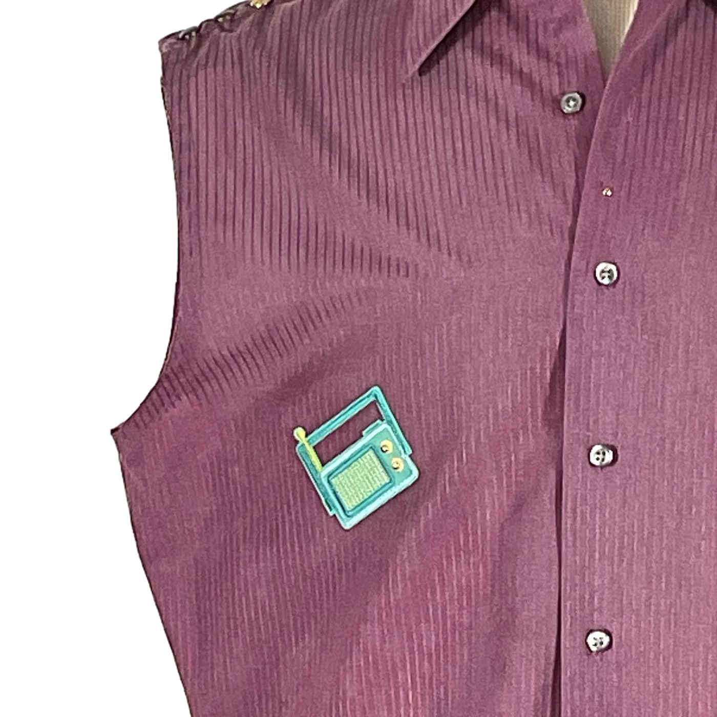 ATARI Men's Custom Sleeveless Shirt featuring a unique small radio pin on a purple fabric, showcasing bold and distinctive wearable art.