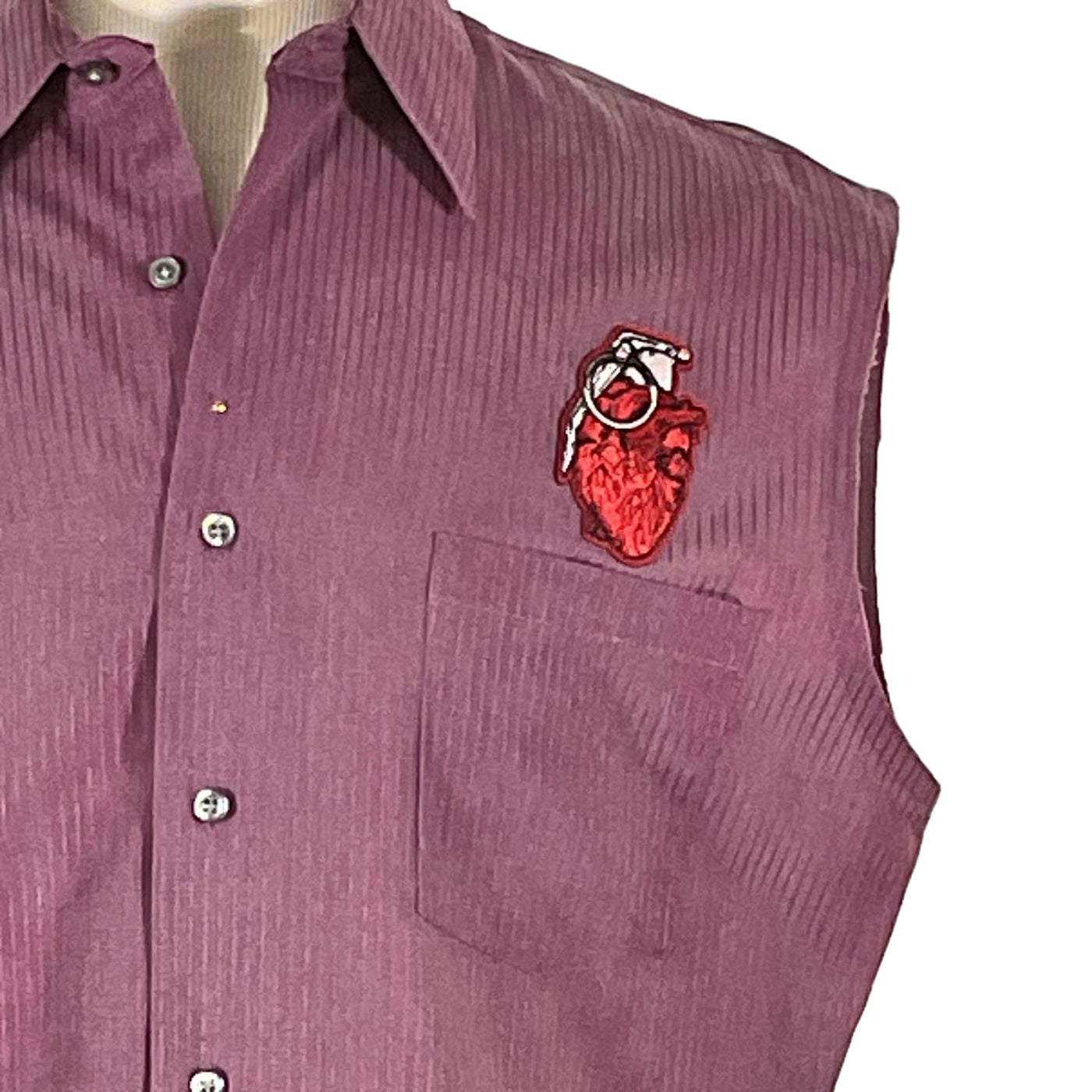 ATARI Men's Custom Sleeveless Shirt, featuring a heart patch, exemplifies bold, unique design in wearable art crafted from pre-owned, 100% cotton garments.