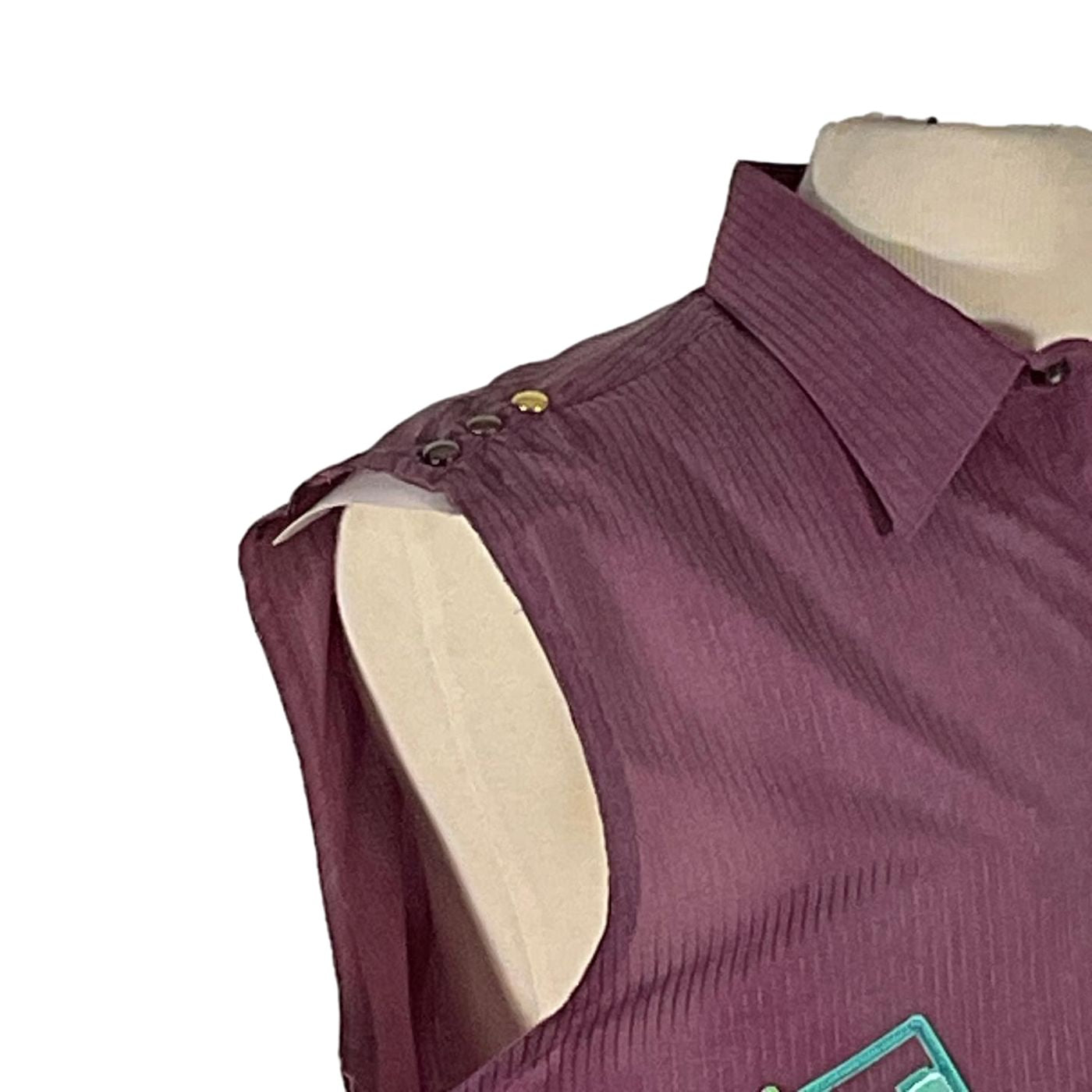 ATARI Men's Custom Sleeveless Shirt displayed on a mannequin, featuring a unique shoulder cut-out design, exemplifying the bold and distinctive style of DEVIOUS SAINT.