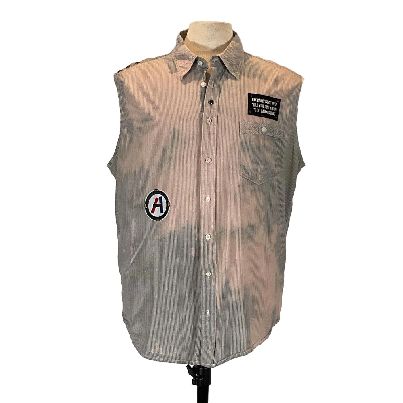 FORT LAUDERDALE Men's Custom Sleeveless Shirt on mannequin, featuring patches and distinctive design, emphasizing bold, unique style by DEVIOUS SAINT.