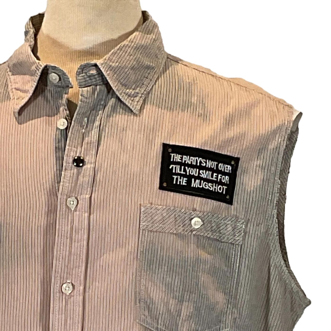FORT LAUDERDALE Men's Custom Sleeveless Shirt featuring a close-up of the collar and button details, showcasing unique craftsmanship in pre-owned cotton fabric.