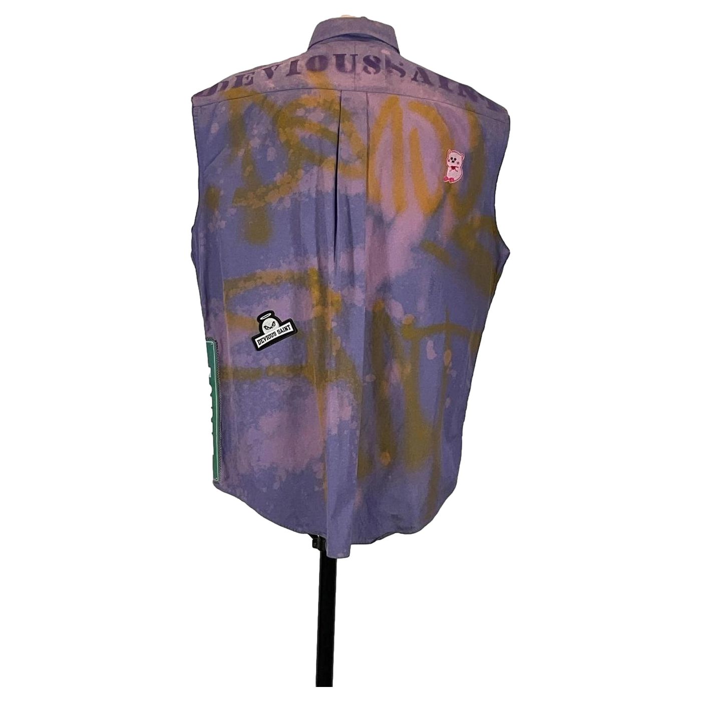 DEVIOUS SAINT Men's Custom Sleeveless Shirt featuring distinctive patches, including a face with a halo.