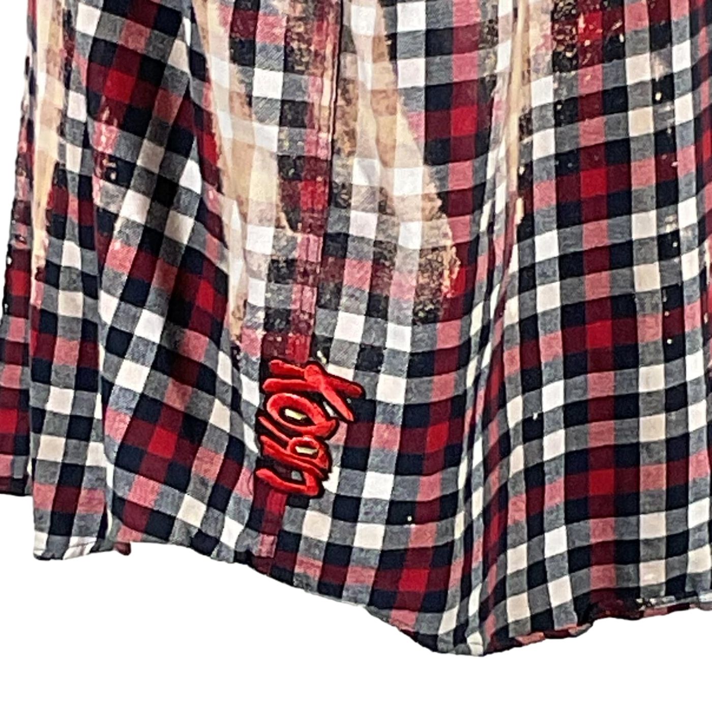 Close-up of NIRVANA Men's Custom Long-Sleeve Flannel Shirt, showcasing a distinctive plaid pattern, emphasizing its bold, unique design.