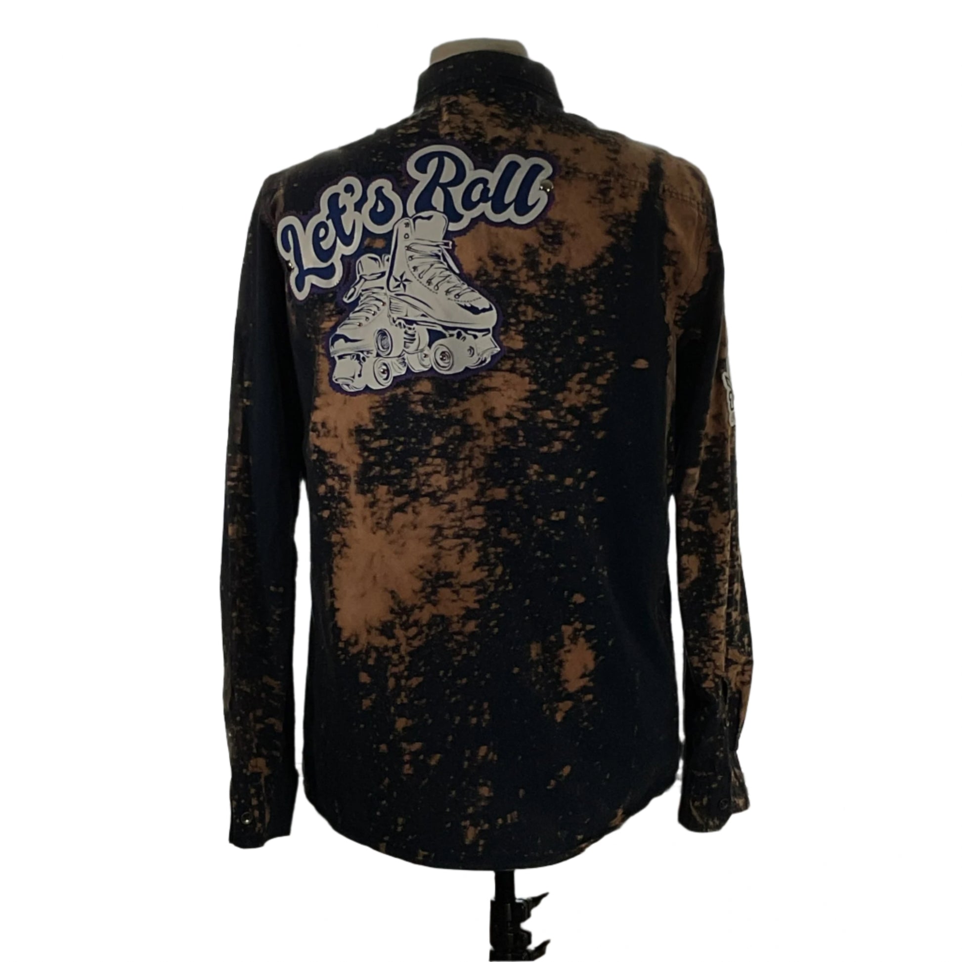 Men's custom long-sleeve flannel shirt, LET’S ROLL!, with roller skate graphic on the back, embodying Devious Saint's unique, bold style.