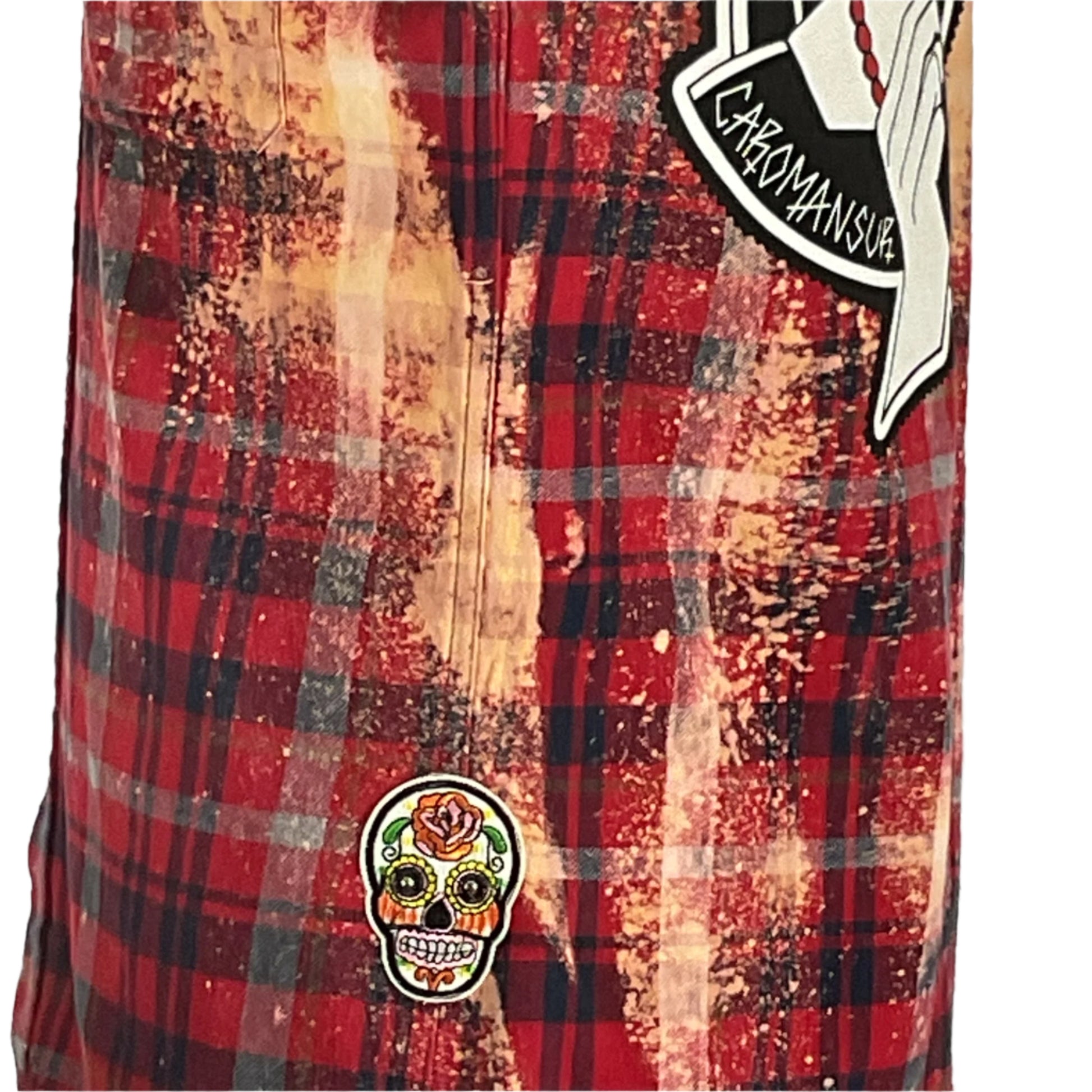 Close-up of a red and black plaid flannel shirt with patches, showcasing the bold design of the Caromamsour Men's Custom Long-Sleeve Flannel Shirt.