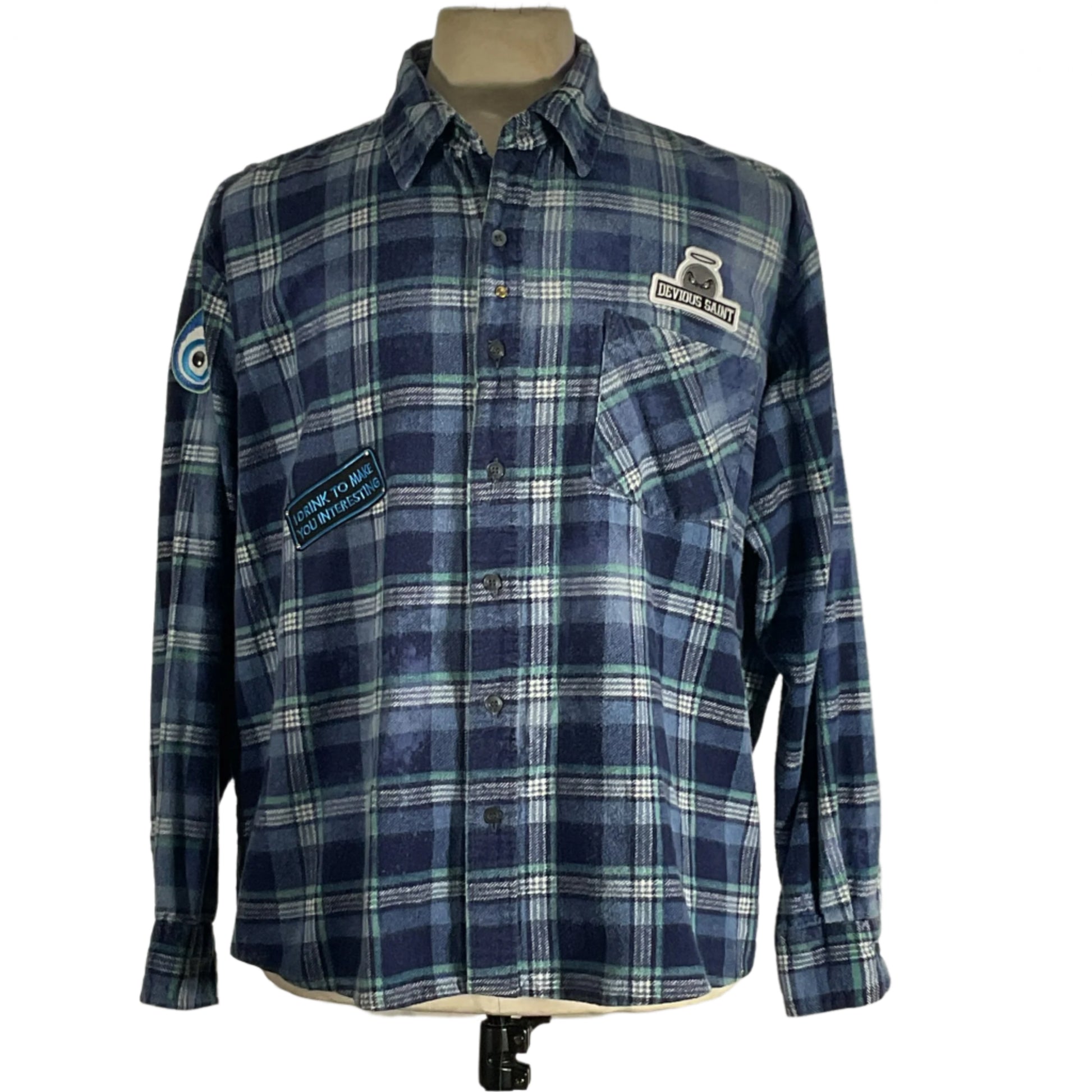 Blue plaid shirt on mannequin, showcasing the Iron Maiden Men's Custom Long-Sleeve Flannel Shirt in 3XL from DEVIOUS SAINT, highlighting its bold style and rugged comfort.