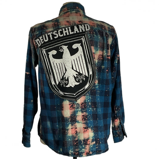 Men's flannel shirt with BE KIND message and a white eagle on the back, embodying DEVIOUS SAINT's distinctive style and comfort.