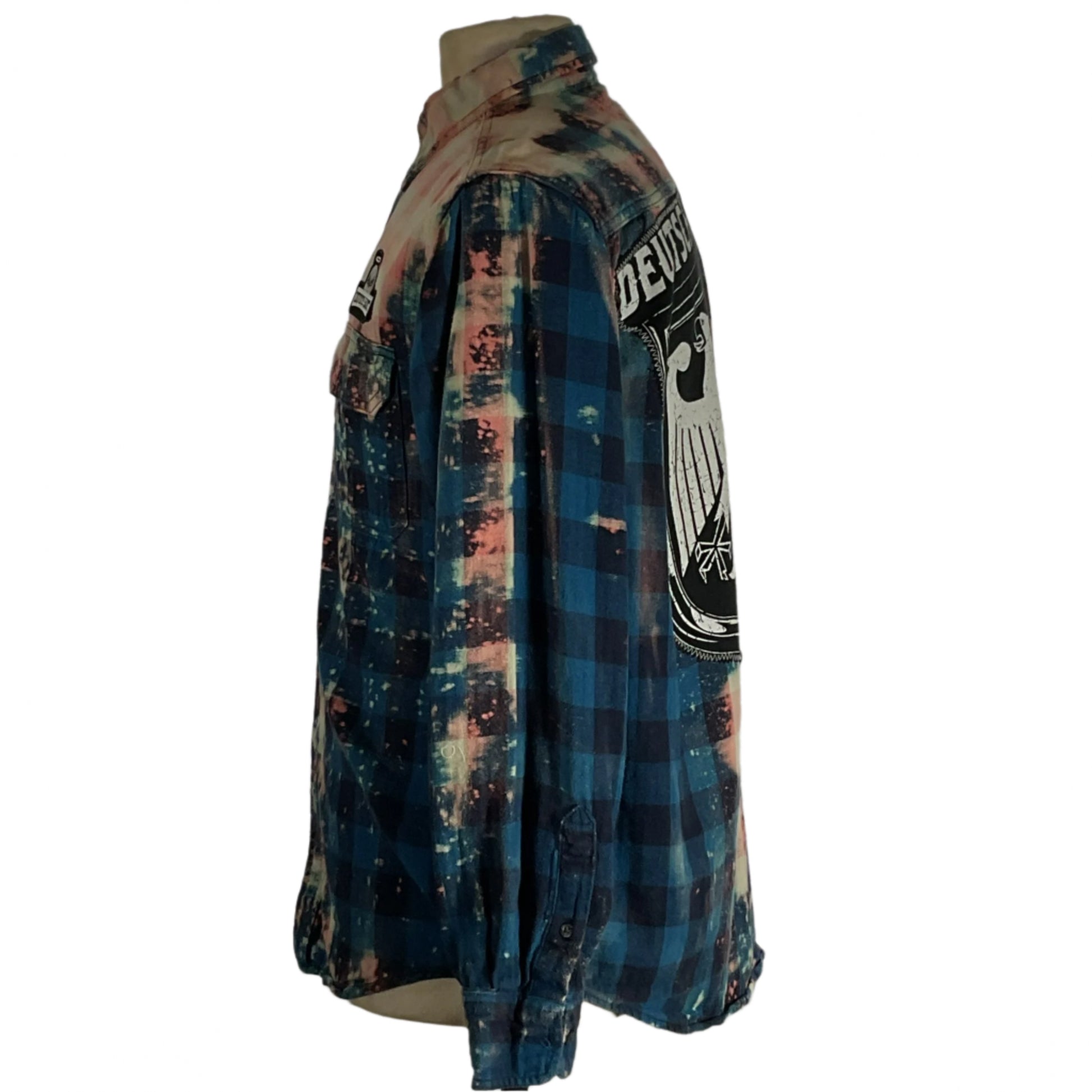 Mannequin displaying DEUTSCHLAND men's custom long-sleeve flannel shirt, medium size, highlighting comfort and style with BE KIND design, reflecting DEVIOUS SAINT's unique, bold ethos.