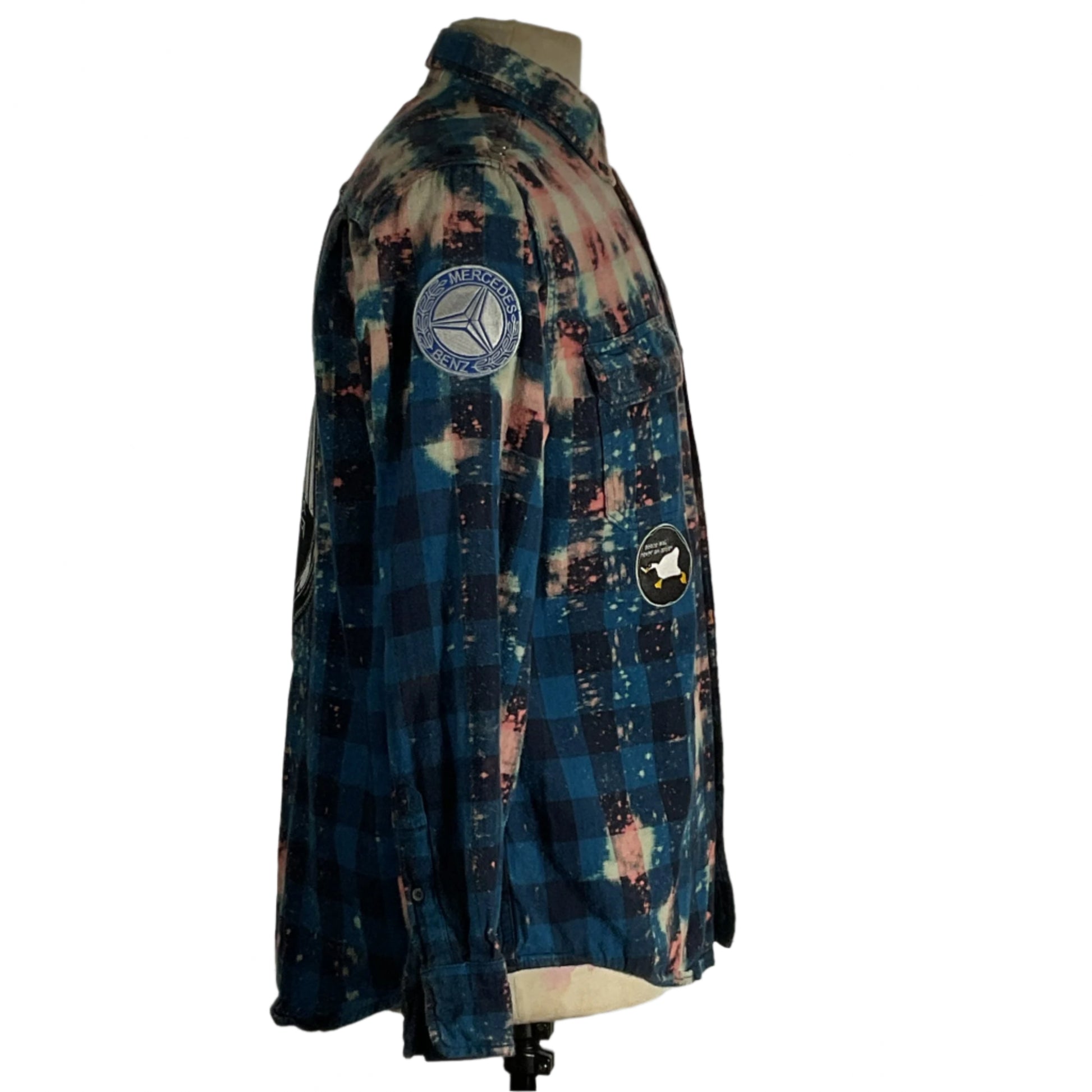 Men's blue and black flannel shirt on mannequin, titled DEUTSCHLAND | Men's Custom Long-Sleeve Flannel Shirt | MEDIUM, showcasing comfort and a positive BE KIND message.