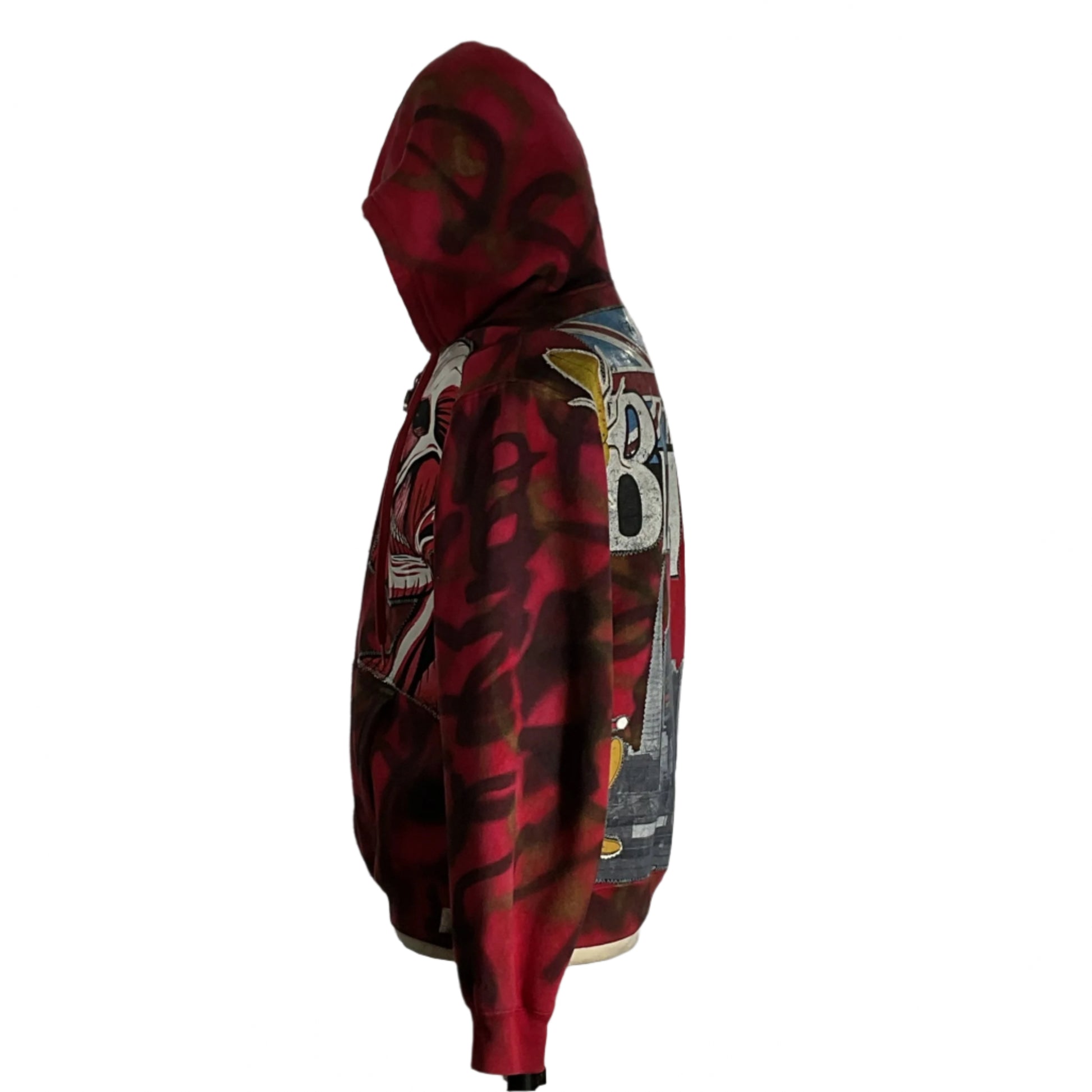 TRUISH| Hoodie | 2 XL, featuring graffiti, sequins, and patches, worn by a person, exemplifies DEVIOUS SAINT's unique wearable art and cultural admiration.