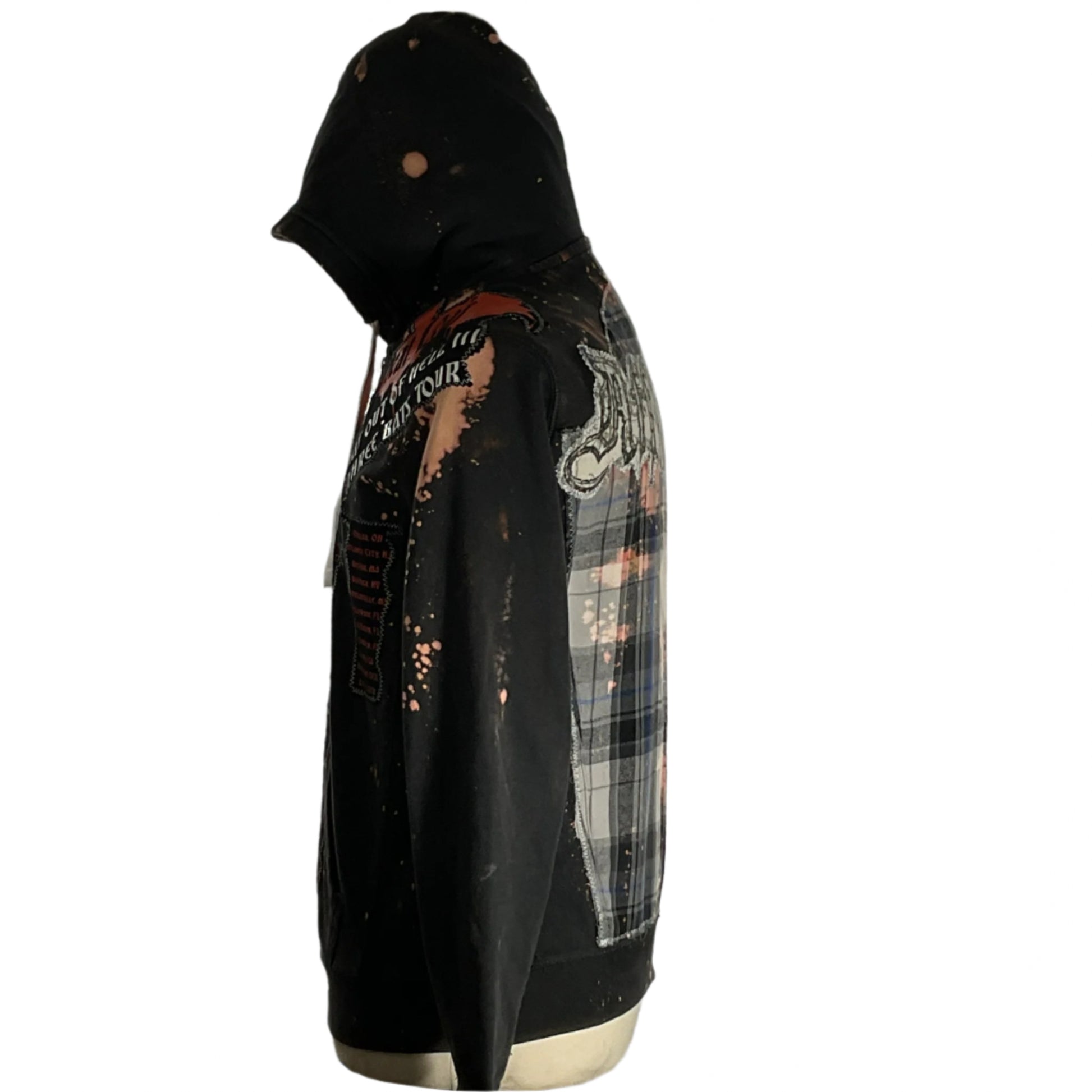 A person wearing the AFFLICTION Custom Men's Hoodie, featuring bold anime-themed patchwork and graffiti design, highlighting unique style and comfort.