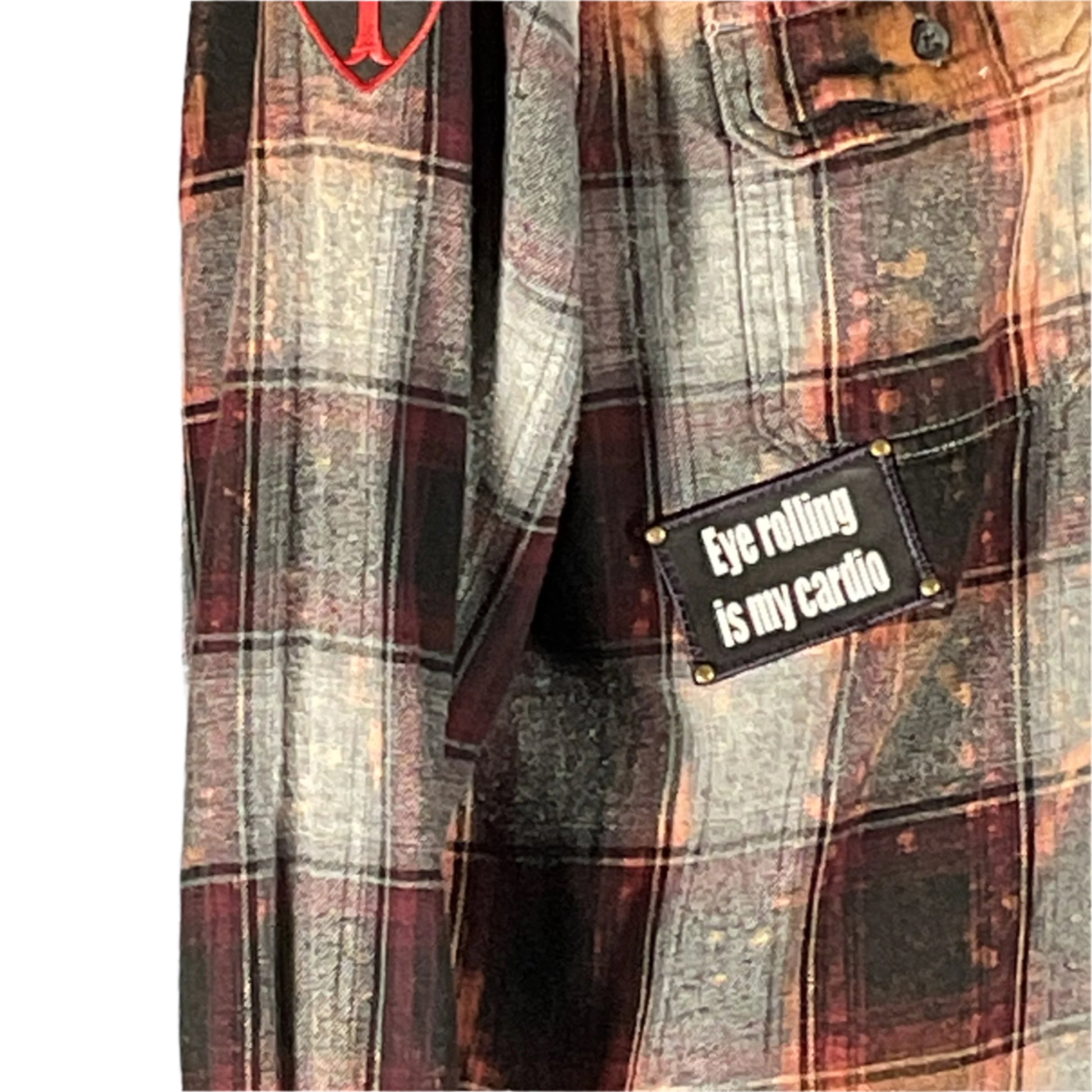 Close-up of a men's small flannel shirt with ANGRY GIRAFFE design, featuring a red and black logo, embodying DEVIOUS SAINT's bold, unique style.
