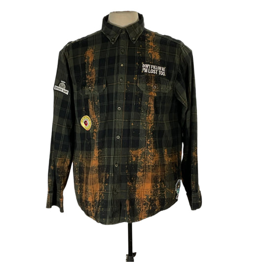 GO COMMANDO | Men's Custom Long-Sleeve Flannel Shirt displayed on a mannequin, showcasing its bold black and brown plaid design, perfect for a distinctive and rugged style statement.