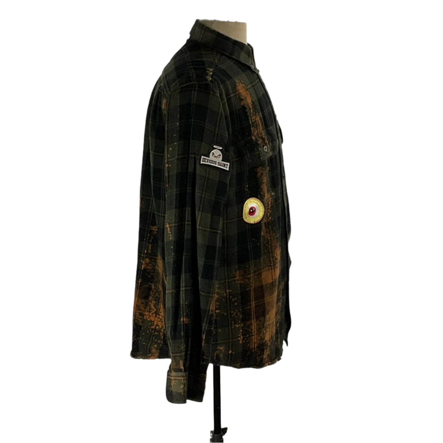 Men's custom long-sleeve flannel shirt on a mannequin, showcasing its bold design and rugged style, epitomizing Devious Saint's unique, artistic fashion ethos.