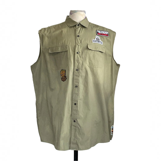 PINK GUMMY BEAR | Men's Custom BEAR SIZE Sleeveless Shirt | 3 XL, featuring assorted patches, including BAD EXAMPLE and a tree-creature, on an olive-green/khaki fabric.