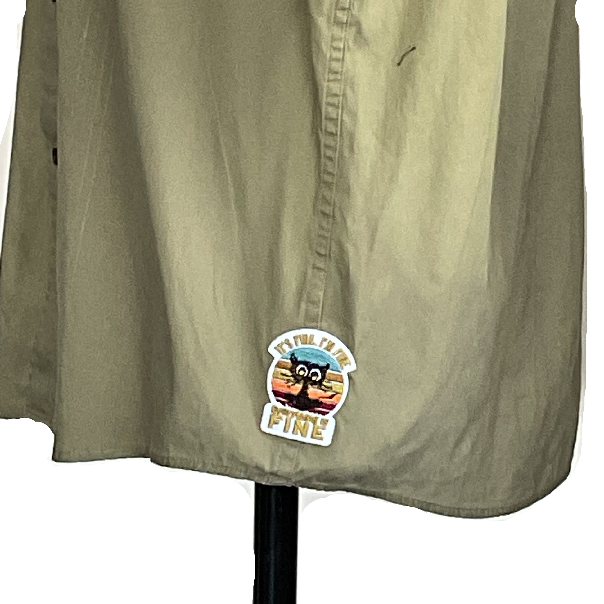 Lower half of the PINK GUMMY BEAR Men's Custom BEAR SIZE Sleeveless Shirt in 3 XL, featuring a playful cartoon cat sticker on light khaki fabric.