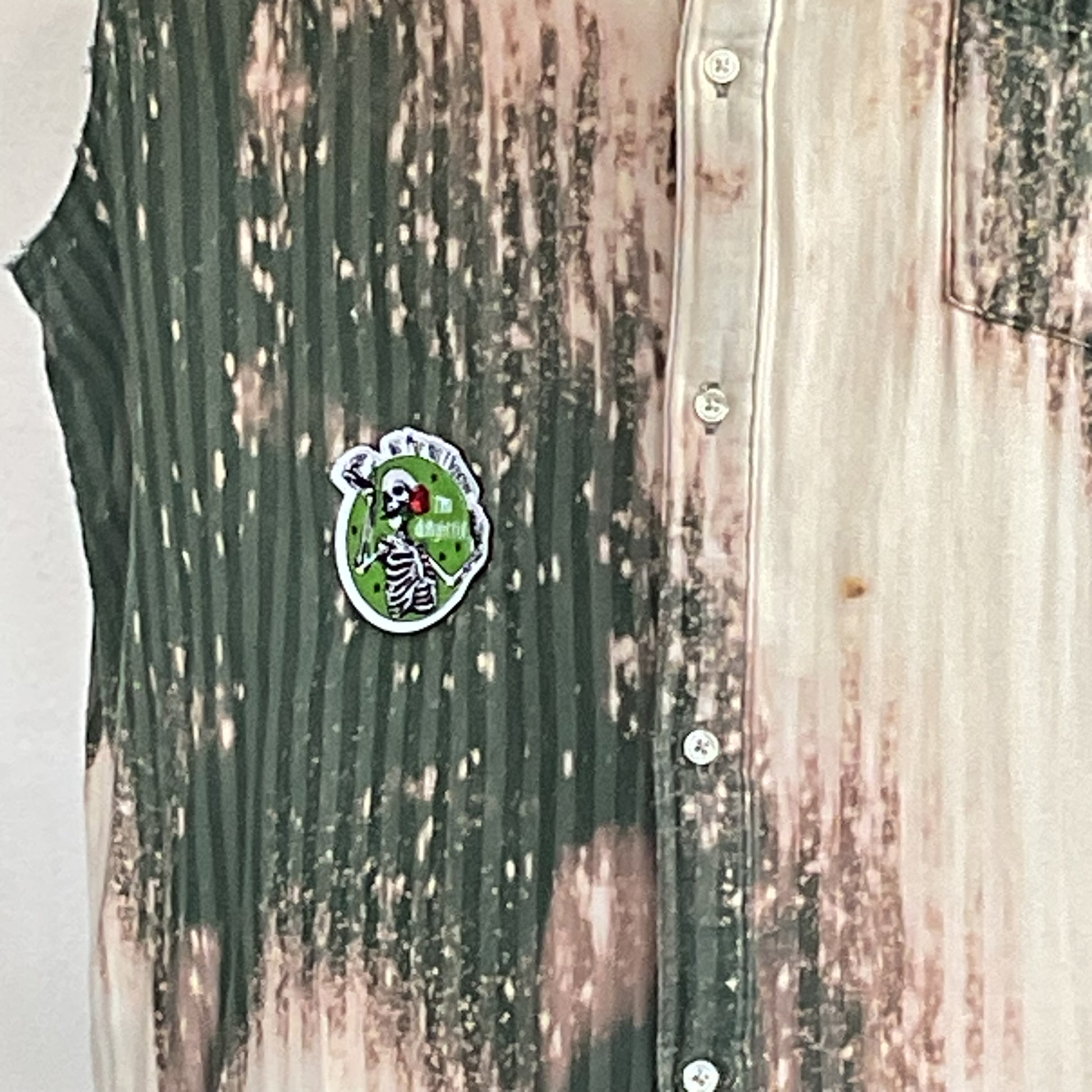PATCHWORK BEAR | Men's Custom BEAR SIZE Sleeveless Shirt | 3 XL, showcasing a mottled, ribbed forest-green with a unique skeleton pin on the chest.