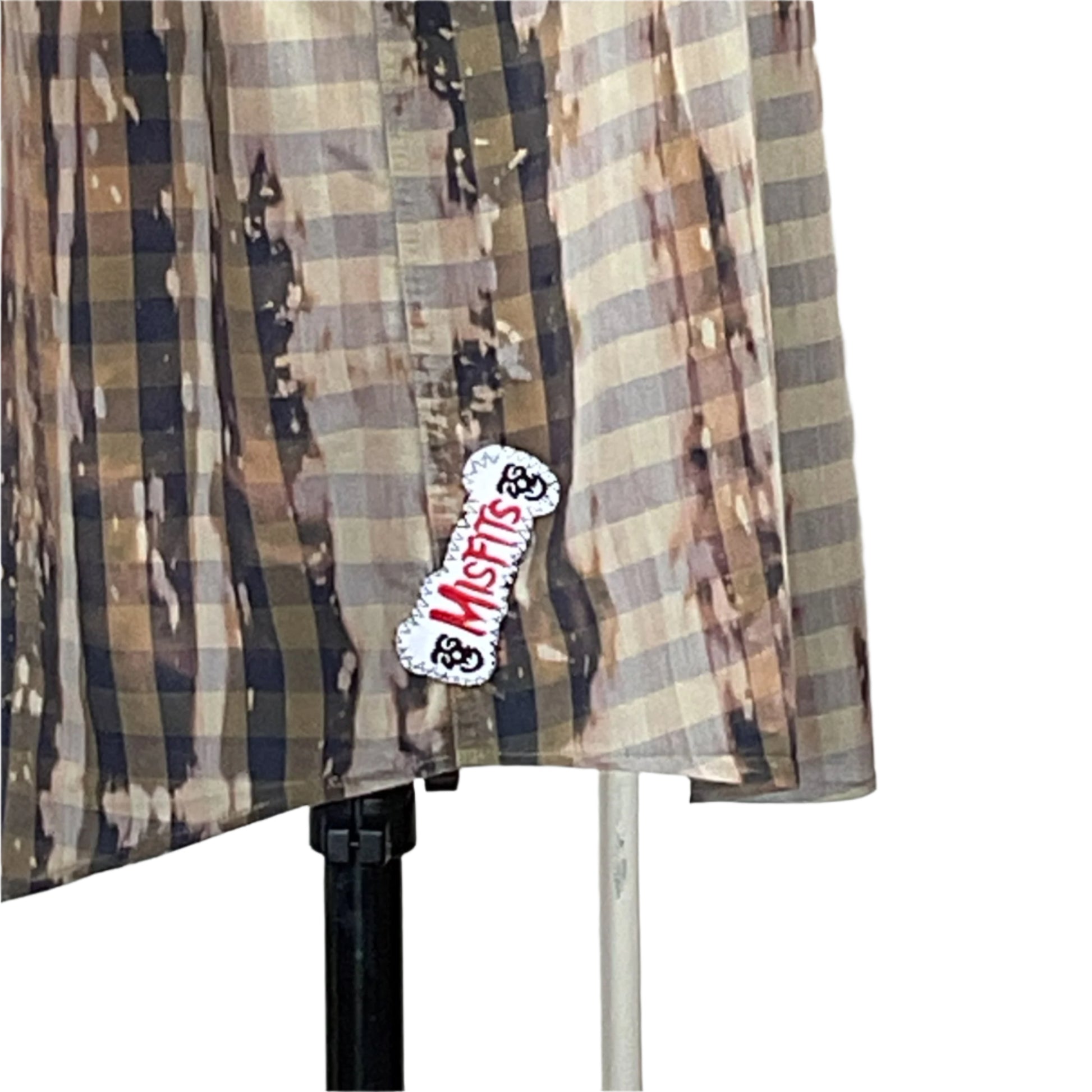 Plaid sleeveless shirt, olive-and-tan with bleach splatter, features Misfits patch. SEXY BEAR men's custom size 2XL, embodying bold, adventurous style.