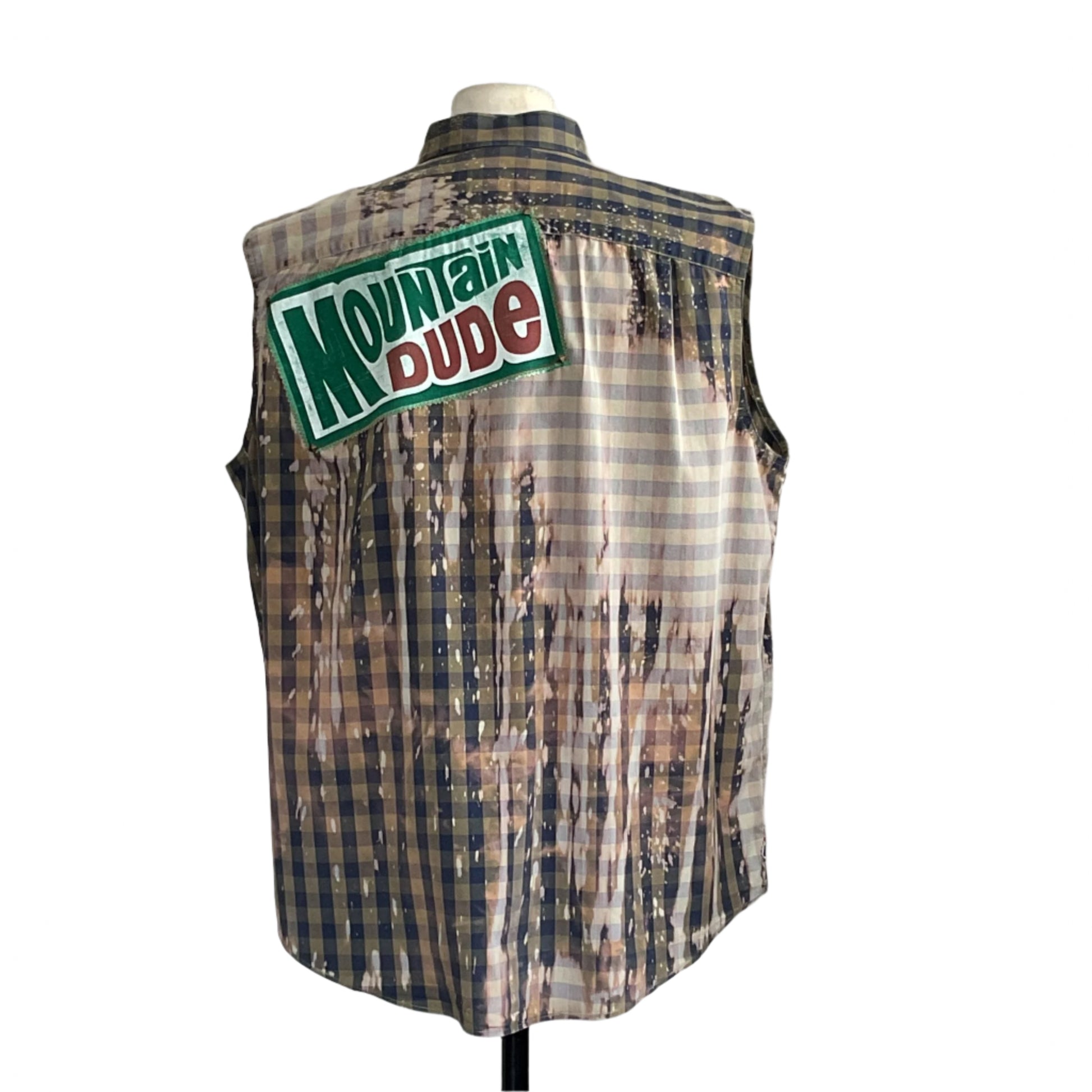 Back view of SEXY BEAR | Men's Custom BEAR SIZE Sleeveless Shirt in 2XL, featuring a bleached plaid design and a Mountain Dude patch on upper back.