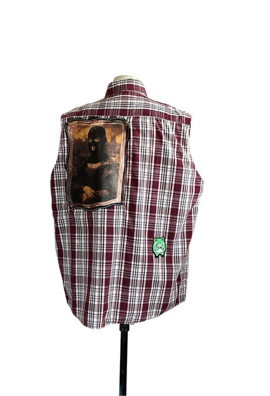 MASKED MONA LISA vest features a red-and-white plaid, sleeveless design with Mona Lisa in a ski mask and a small green cartoon patch on the back.