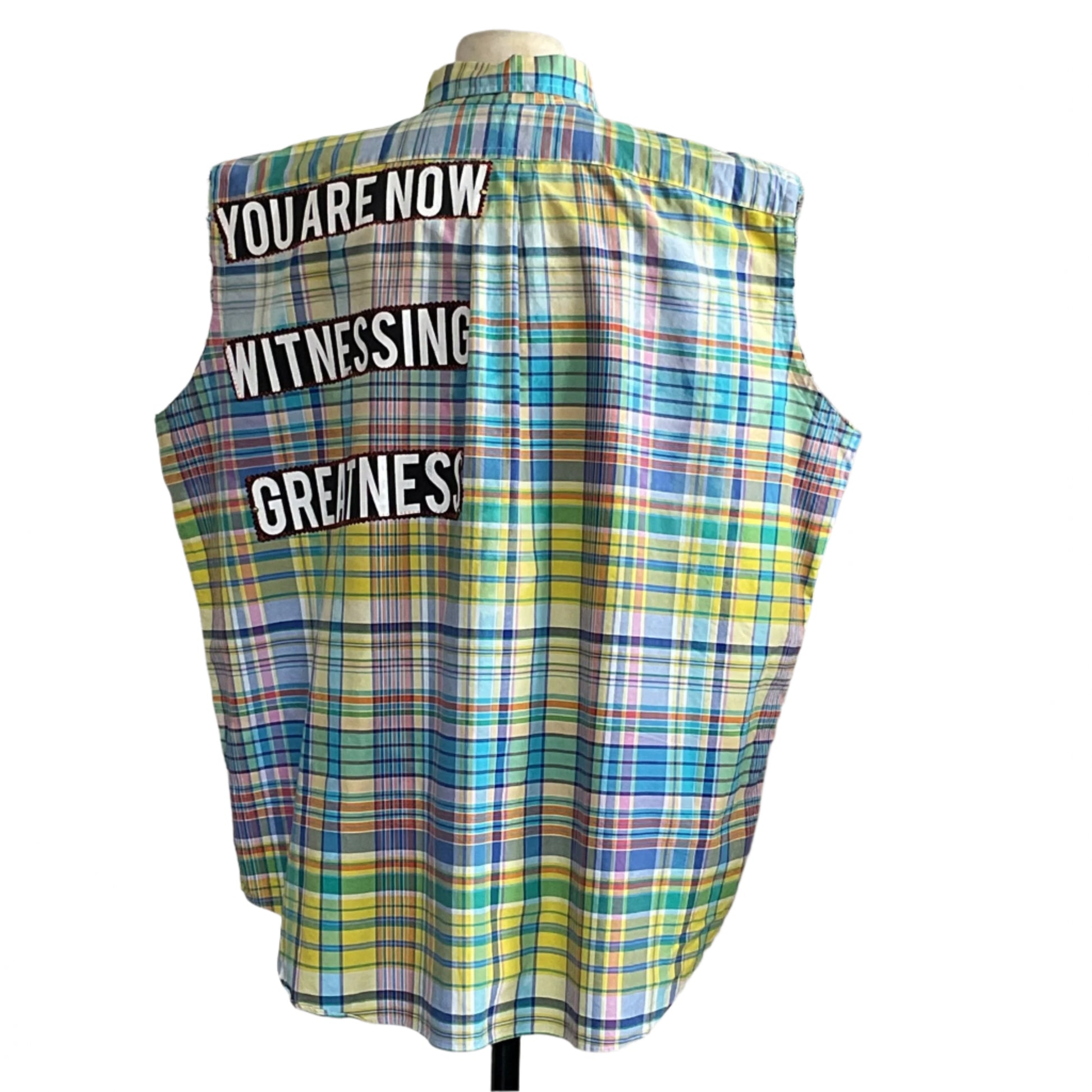 Back view of the WITNESSING men's custom BEAR SIZE sleeveless shirt, 3XL, featuring multicolored plaid and bold patches reading YOU ARE NOW WITNESSING GREATNESS.