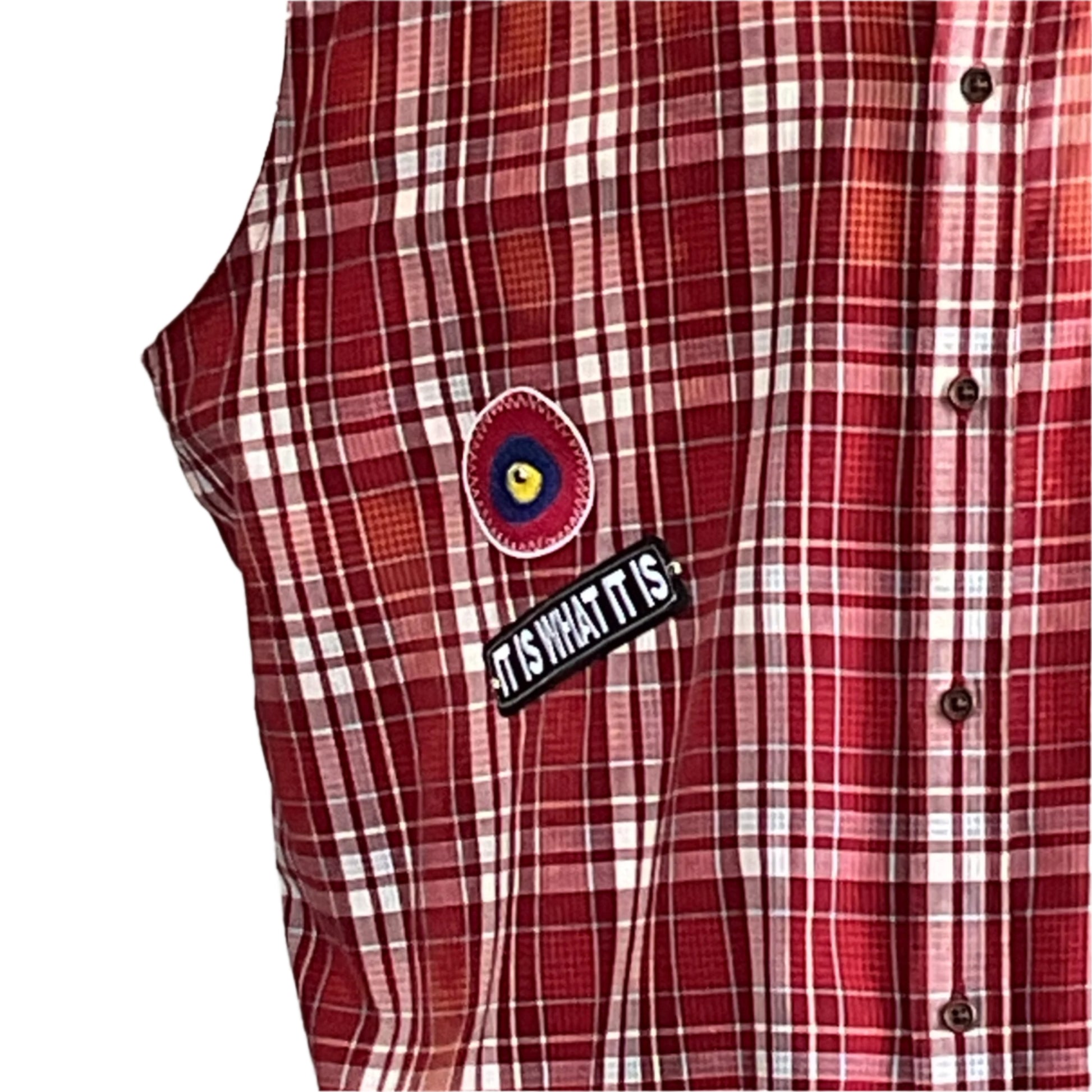 YOUR OPINION | Men's 2XL red-and-white plaid sleeveless shirt with target patch and IT IS WHAT IT IS pin, embodying bold, unique style.