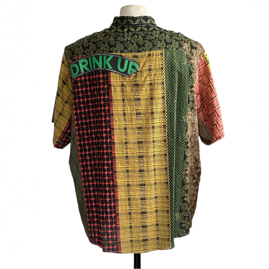 Back view of DRINK UP | Men's Custom BEAR SIZE Sleeveless Shirt | 3XL, featuring colorful patchwork patterns and DRINK UP text across the upper back.
